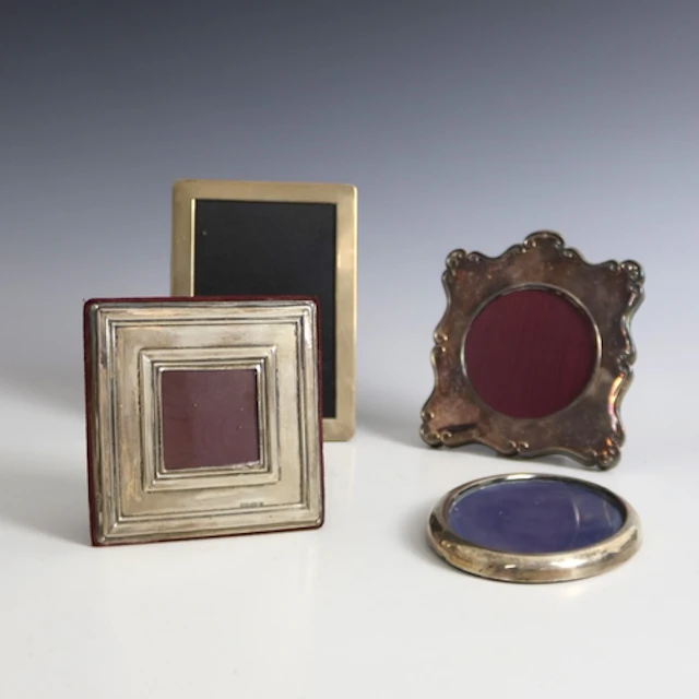 A group of four silver mounted photograph frames, including ...