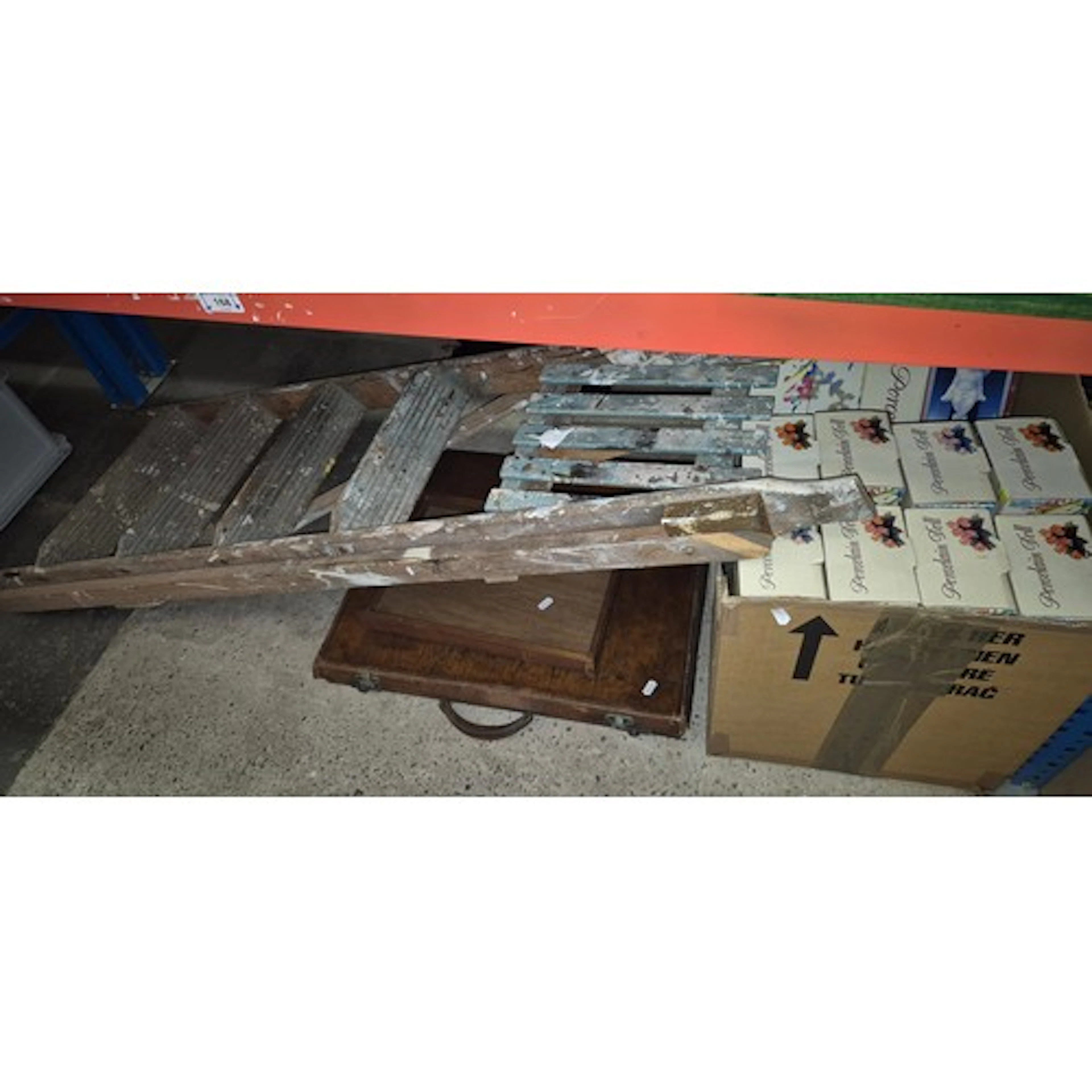 A box of boxed dolls, a slimline leather case, a glass toppe...