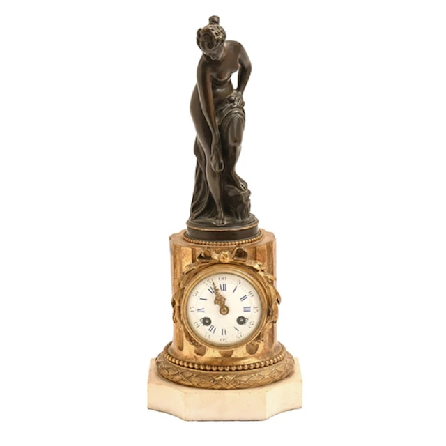 A French bronze and ormolu mantle clock, late 19th c, with f...