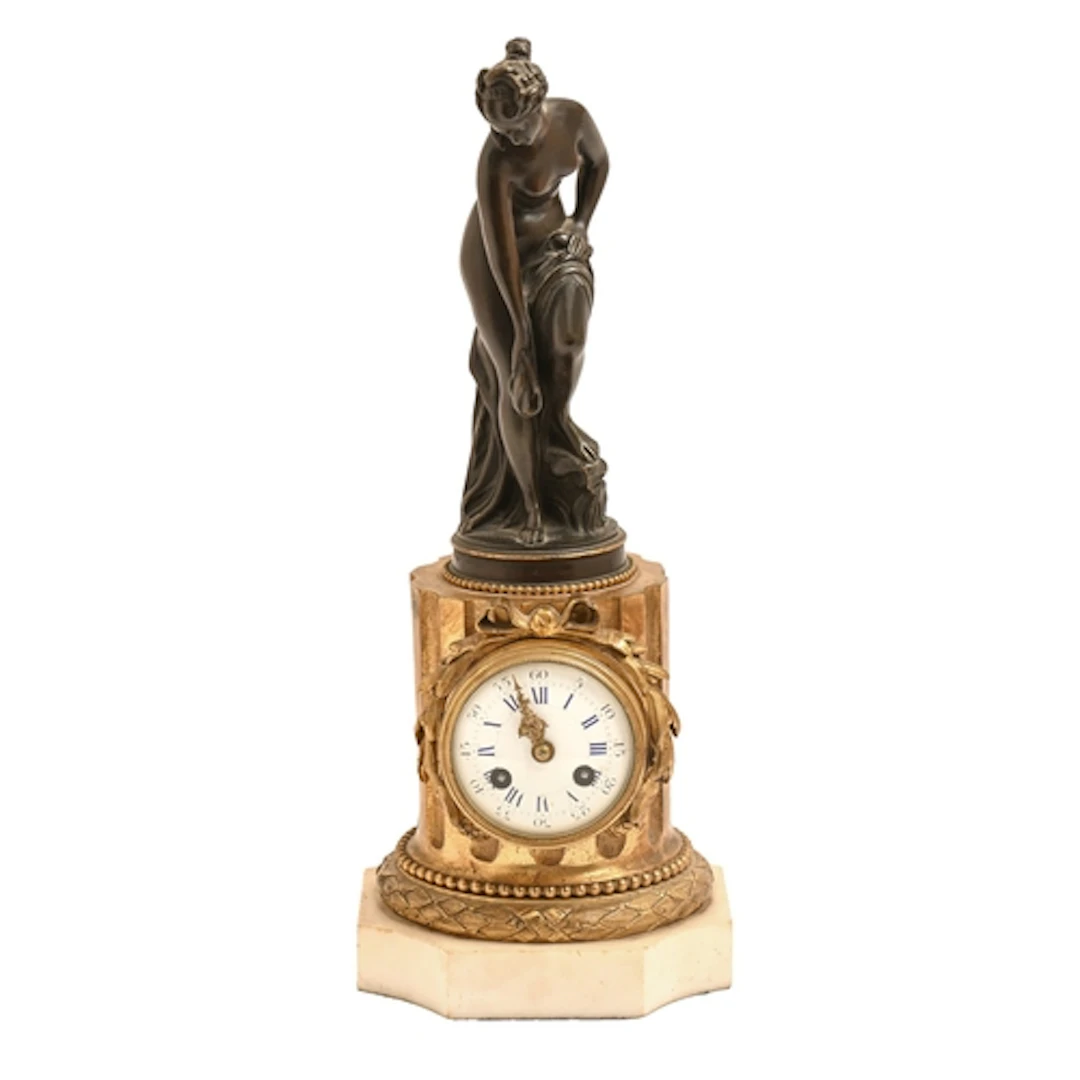 A French bronze and ormolu mantle clock, late 19th c, with f...