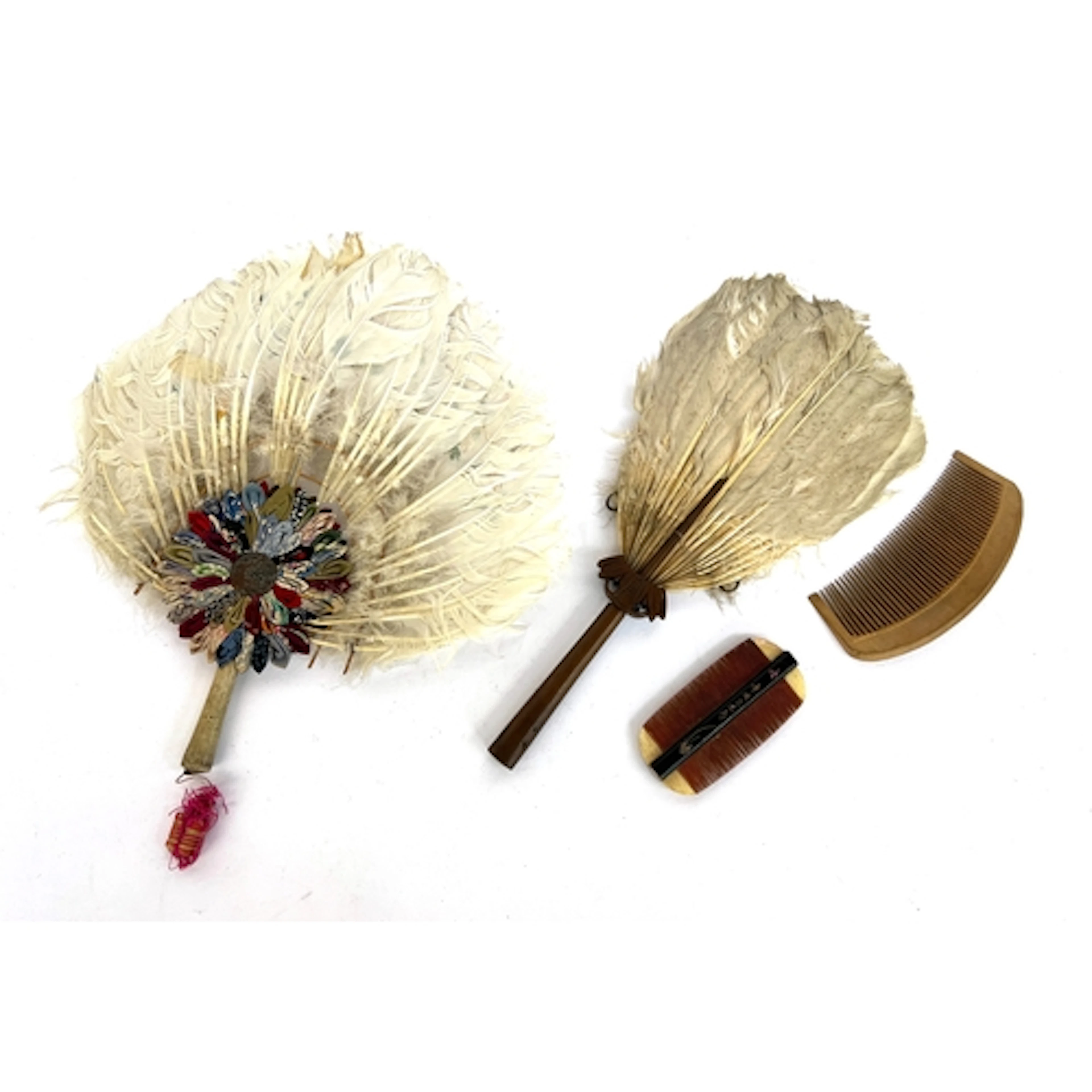 Two antique Chinese rigid feather hand fans, the larger 34cm...