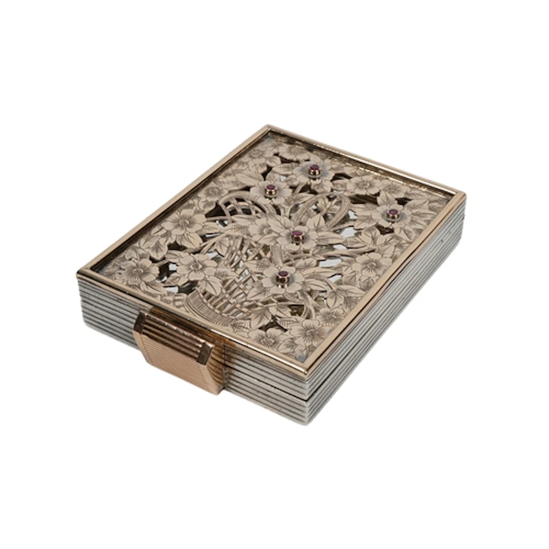 Boucheron, a silver and ruby compact, France, 1940s, of rect...