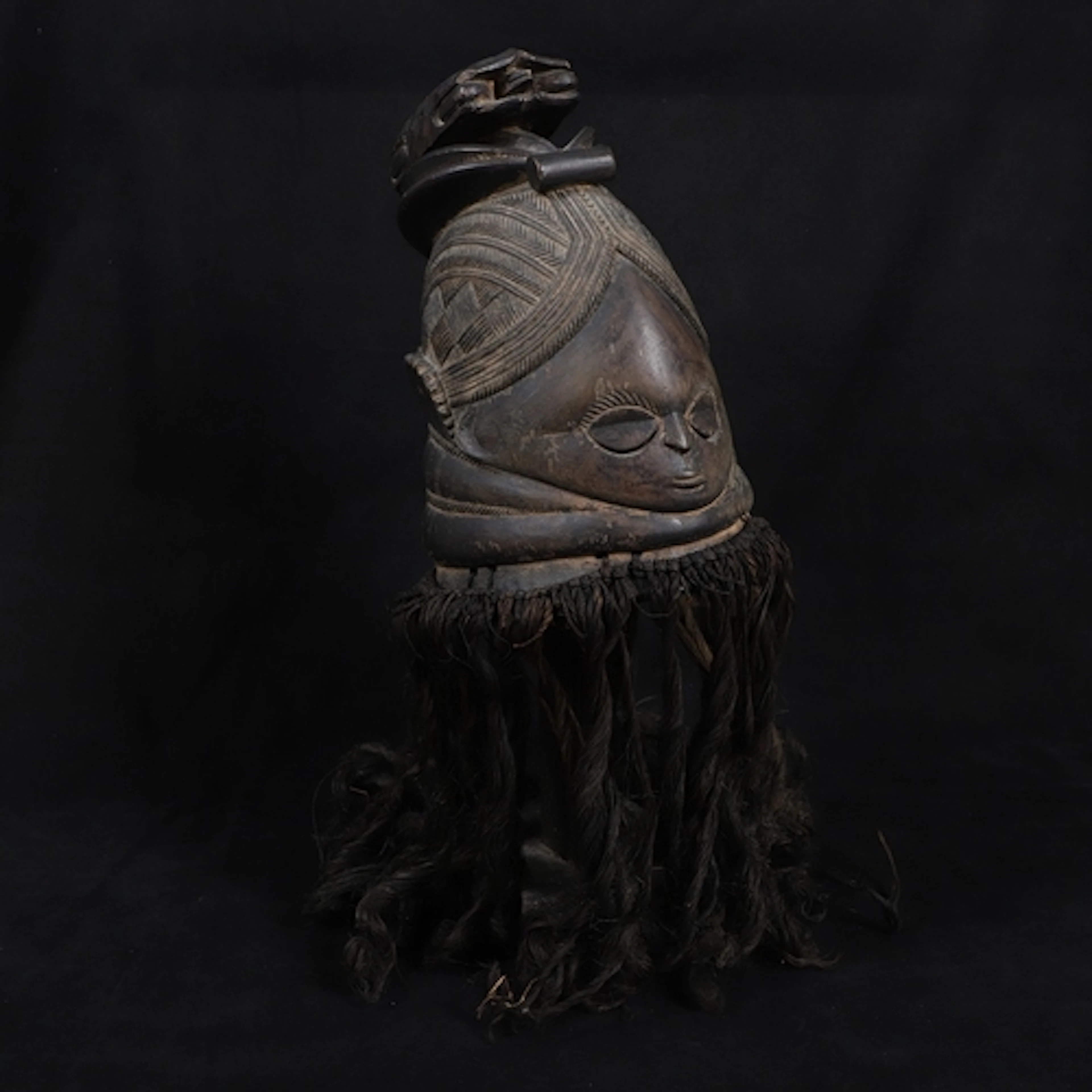 A FINE MENDE HELMET MASK, SIERRA LEONE. A large helmet type ...