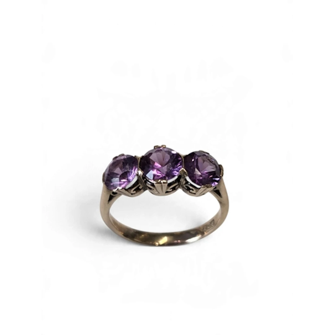 A lovely 9-carat gold three-stone amethyst ring, set with th...