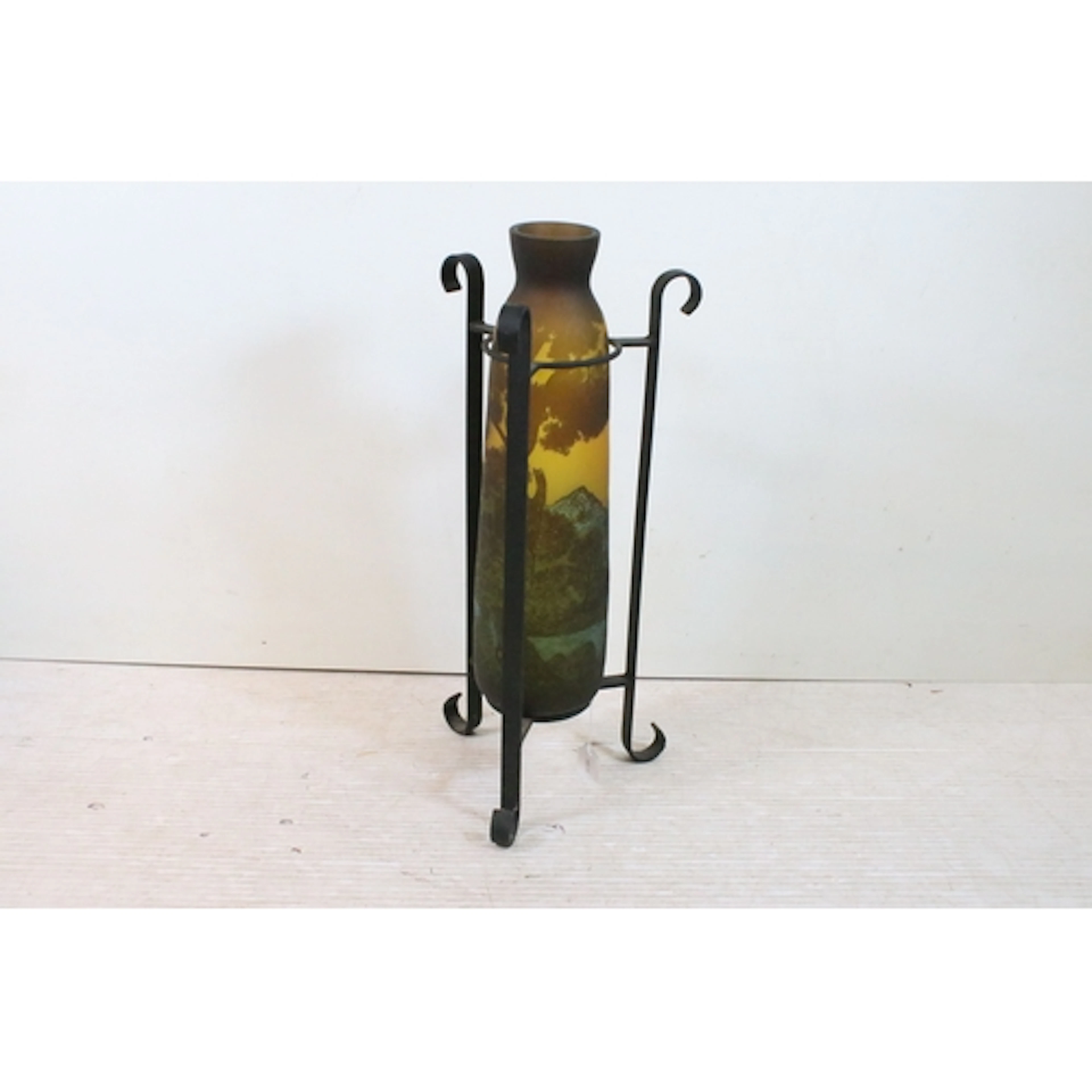 20th century wrought iron vase stand, on tri-form base, the ...