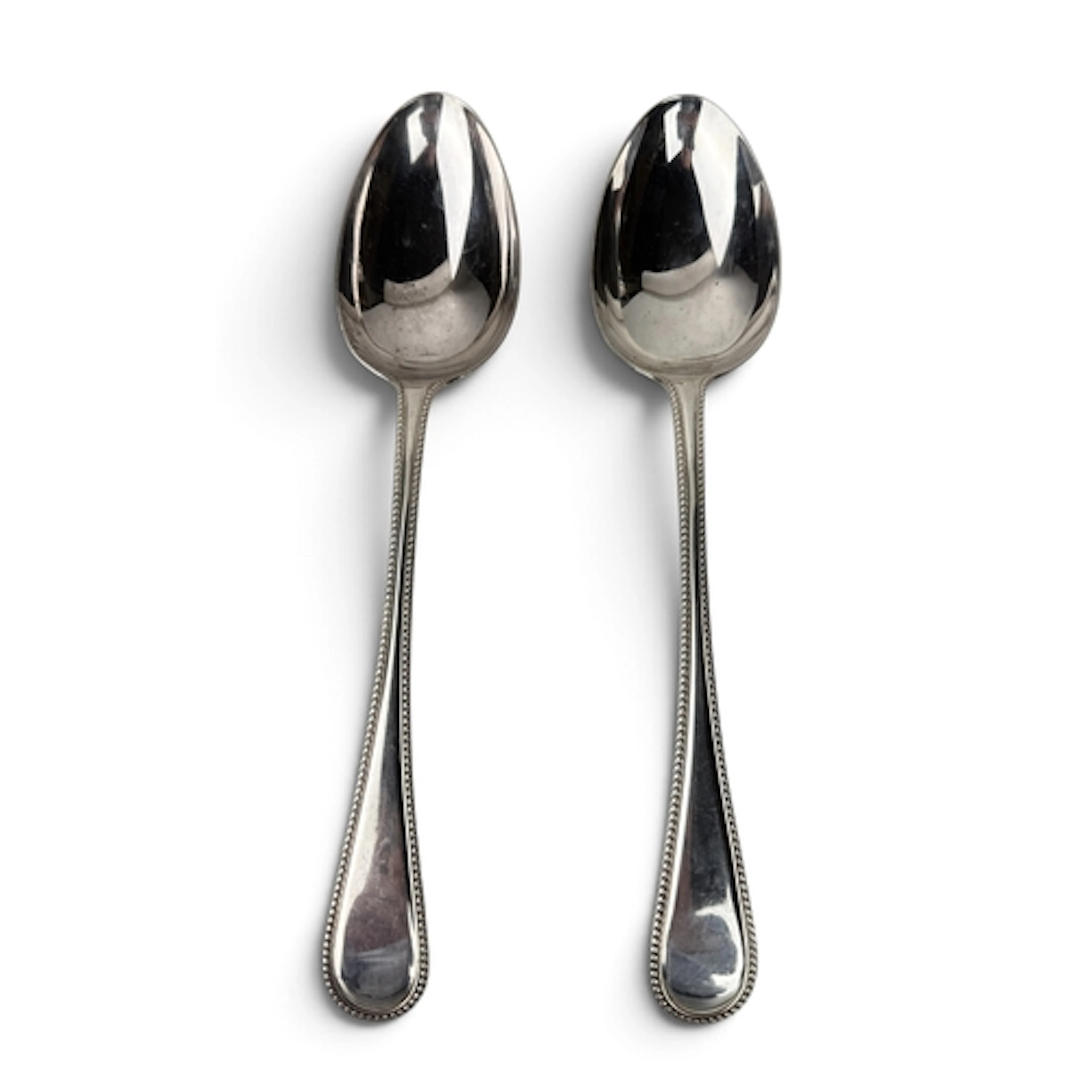 A PAIR OF VICTORIAN SILVER OLD ENGLISH BEAD EDGE TABLESPOONS...