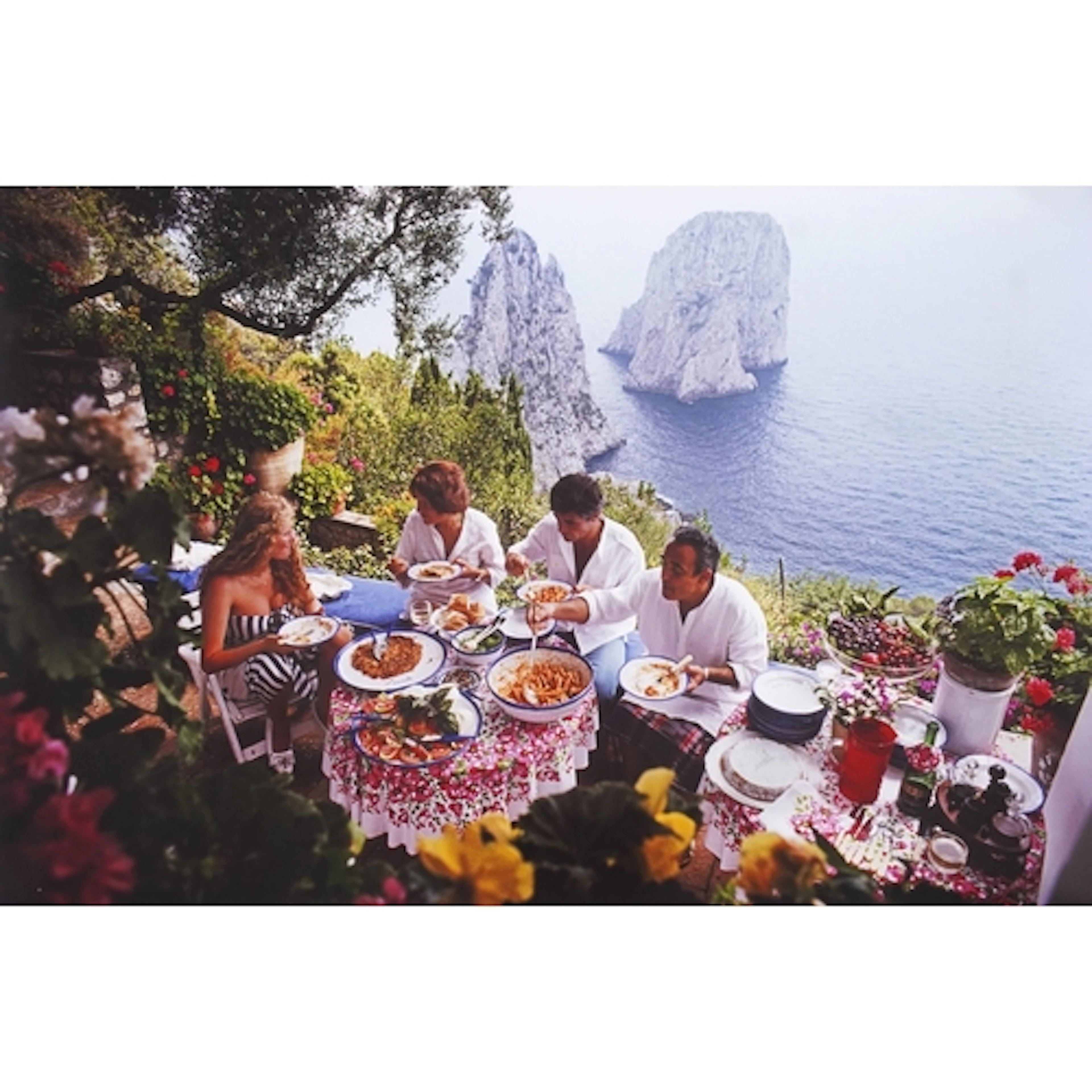 Slim Aarons (American, 1916-2006) 'Dining al fresco on Capr...