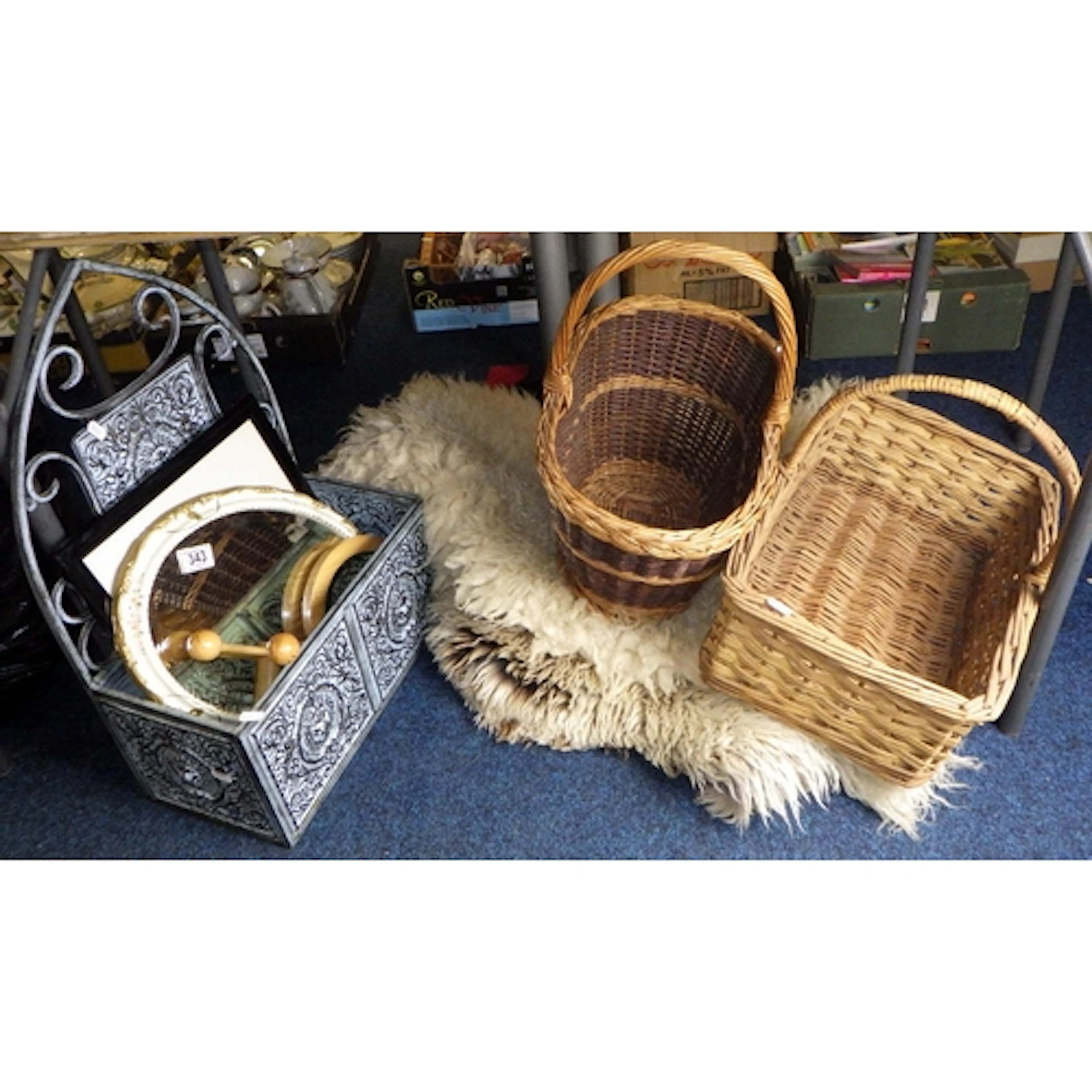 Two sheepskin rugs, baskets, mirrors, wall box etc