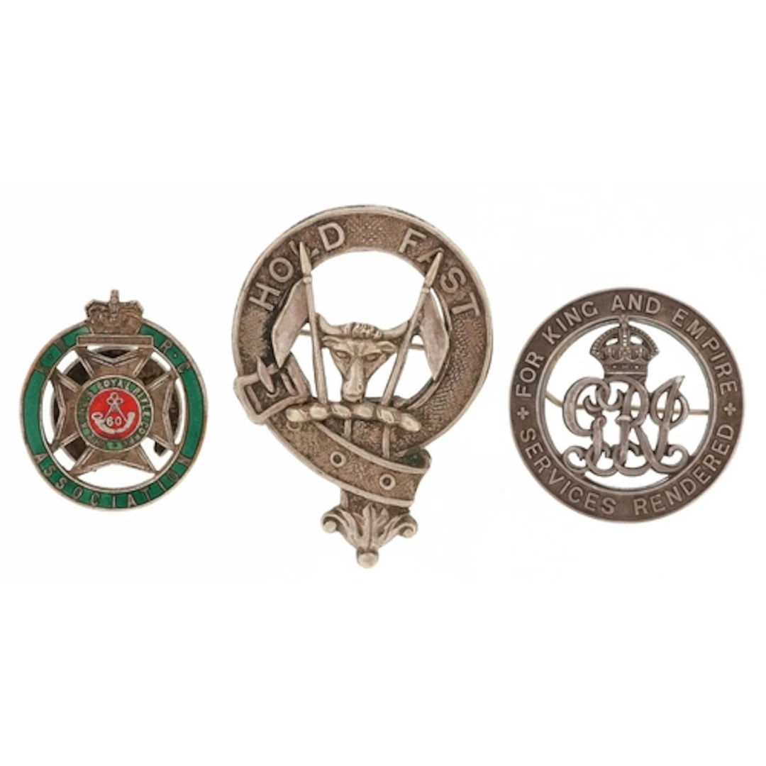 Group of military interest badges including Services Rendere...