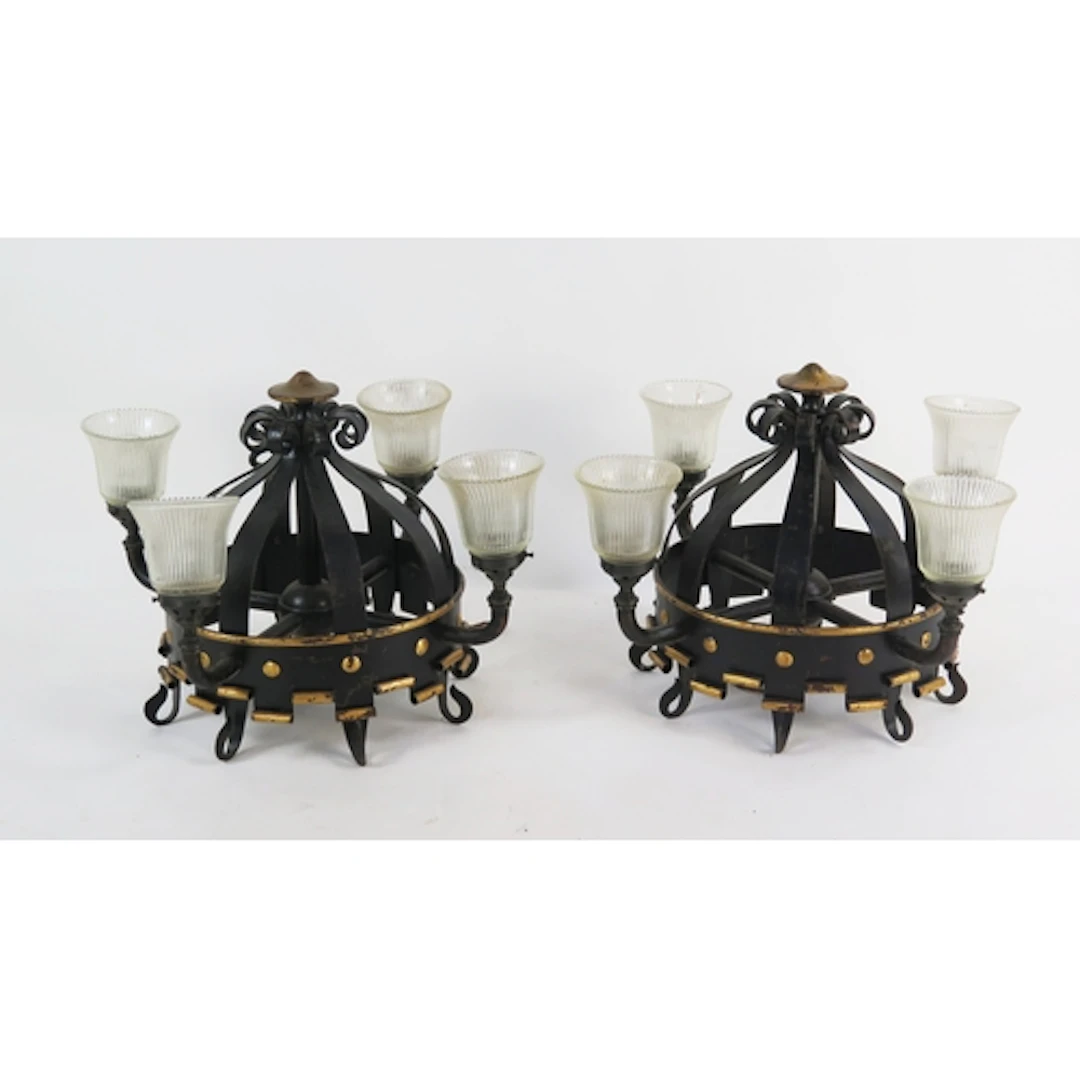 A pair of wrought iron four-light ceiling lights, the corona...
