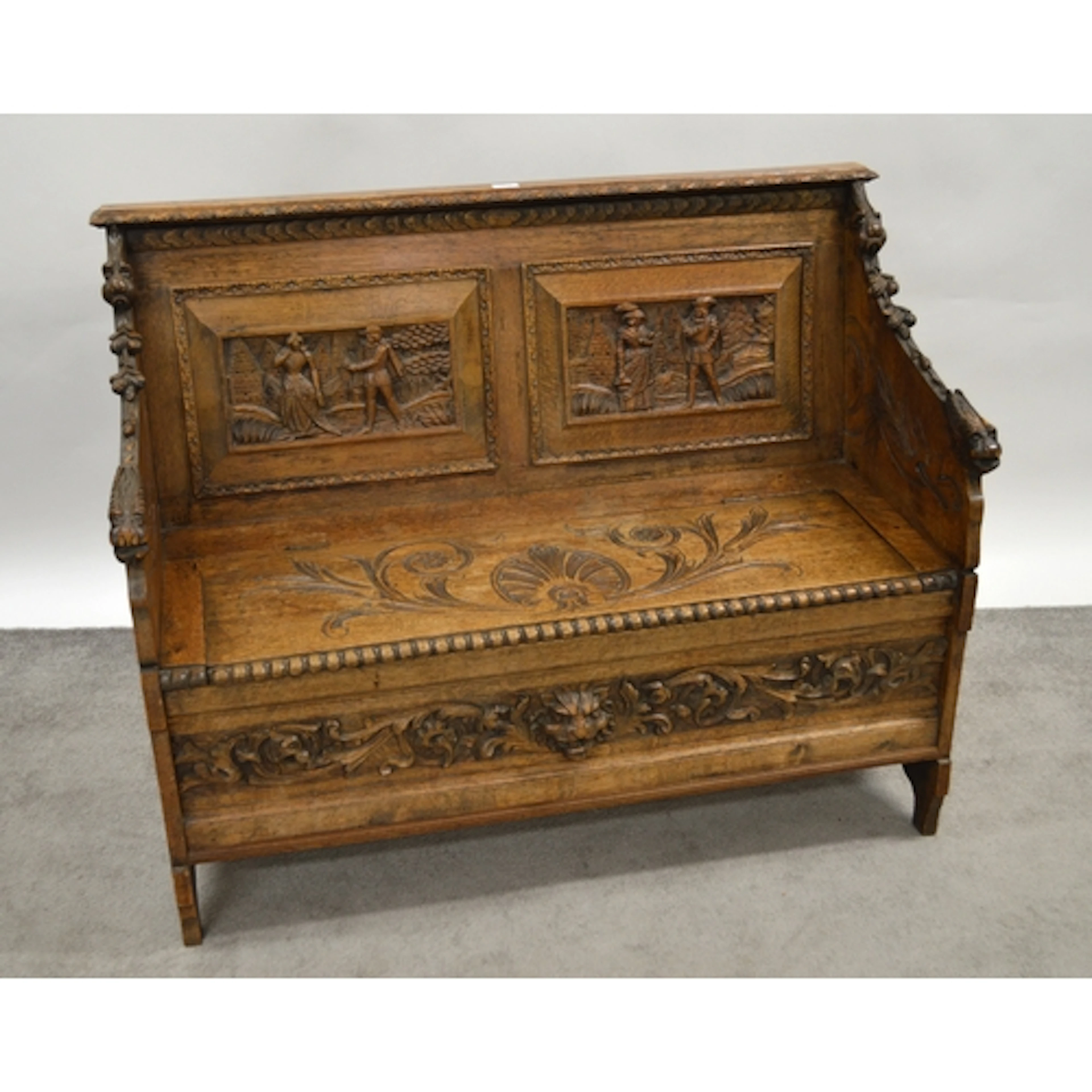 19th Century oak box seat settle, with carved panel back, 11...