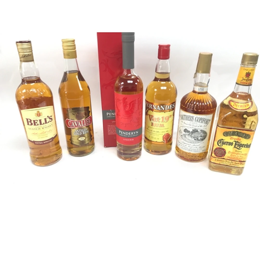 Quantity of whiskey and rum and other bottles. 1 litre of be...