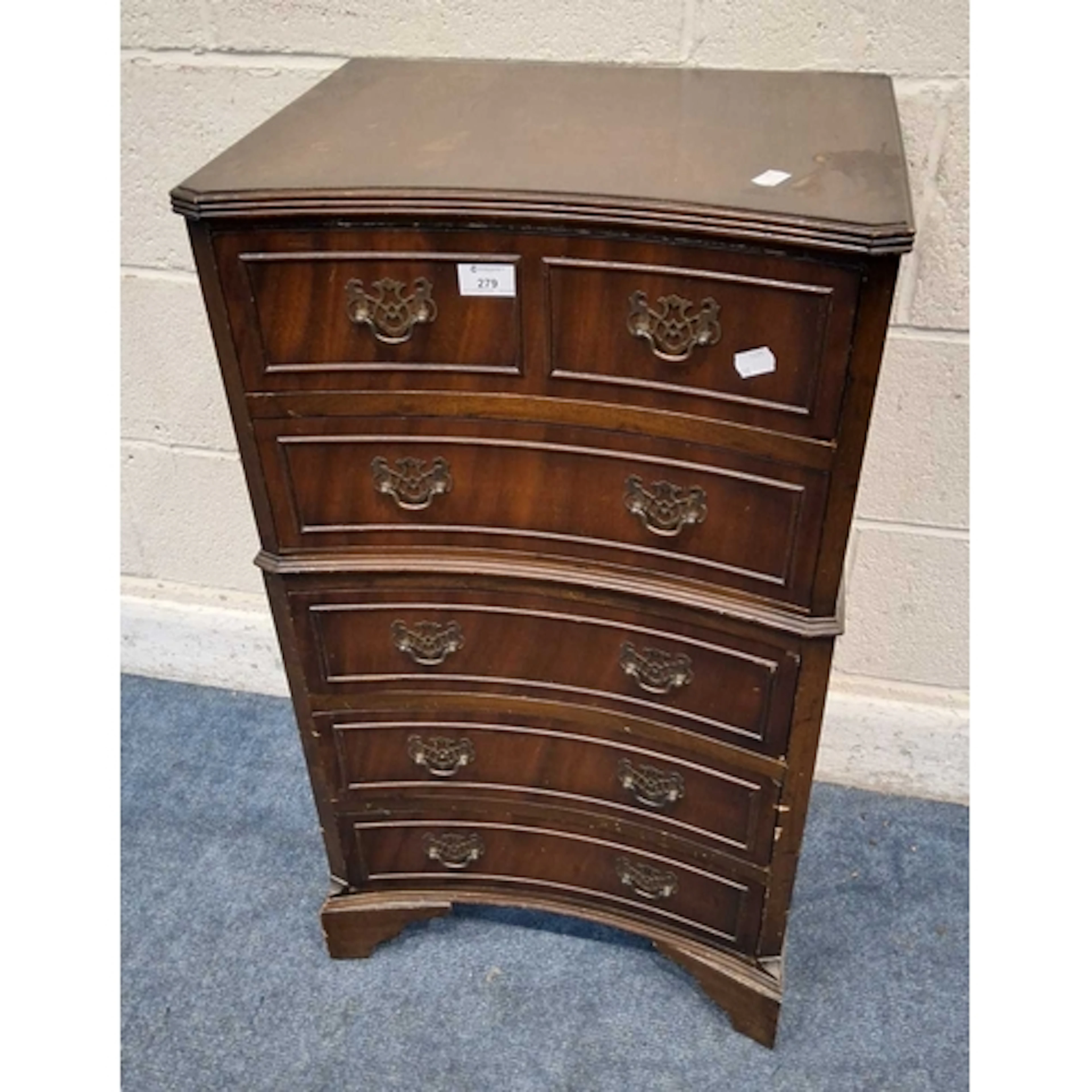 A REPRODUCTION MAHOGANY CONCAVE CHEST OF FIVE DRAWERS, raise...