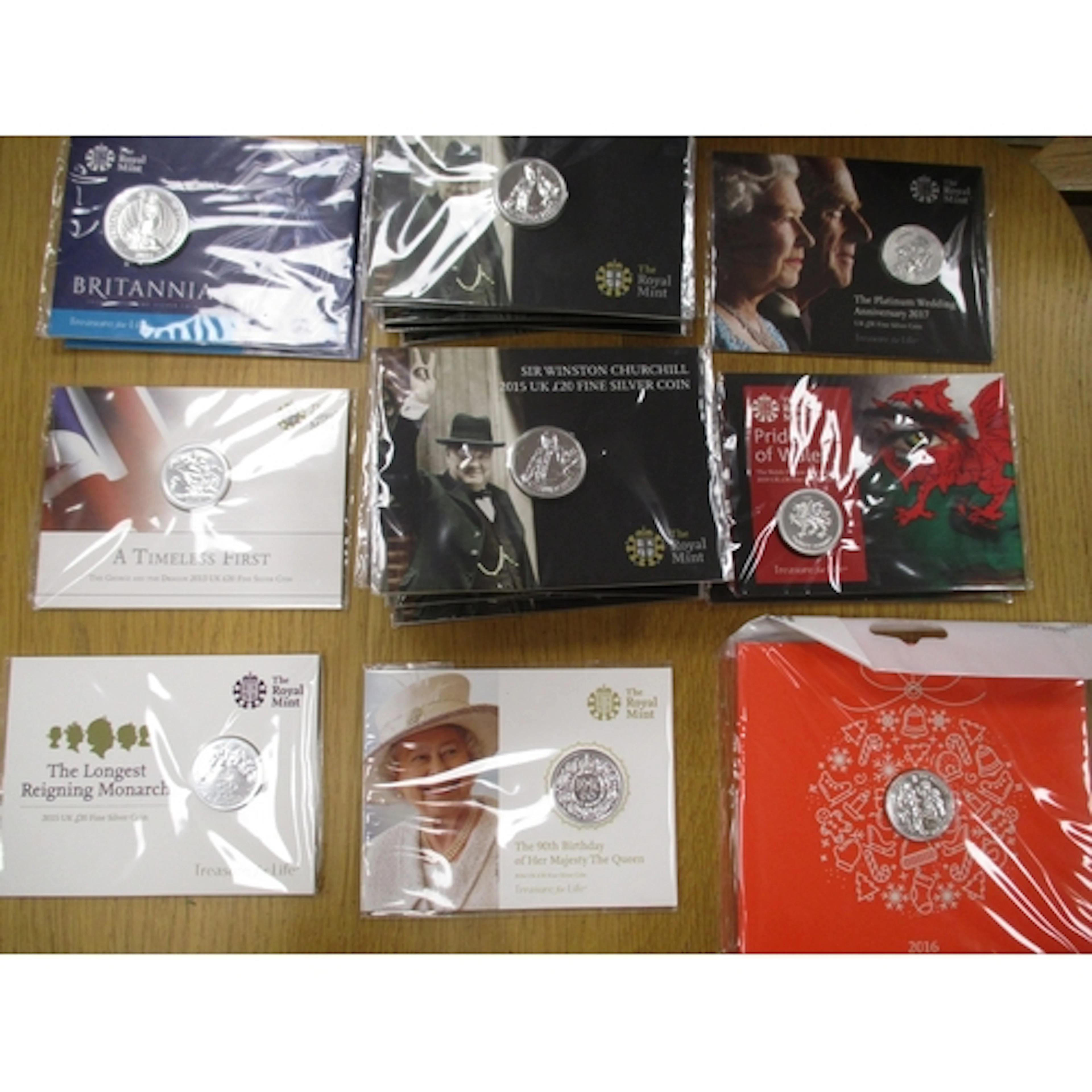 Collection of silver uncirculated folders with £50 2015 (2),...