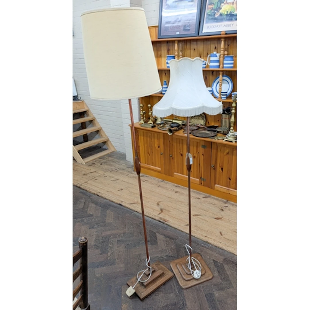 Two retro teak and copper floor lamps