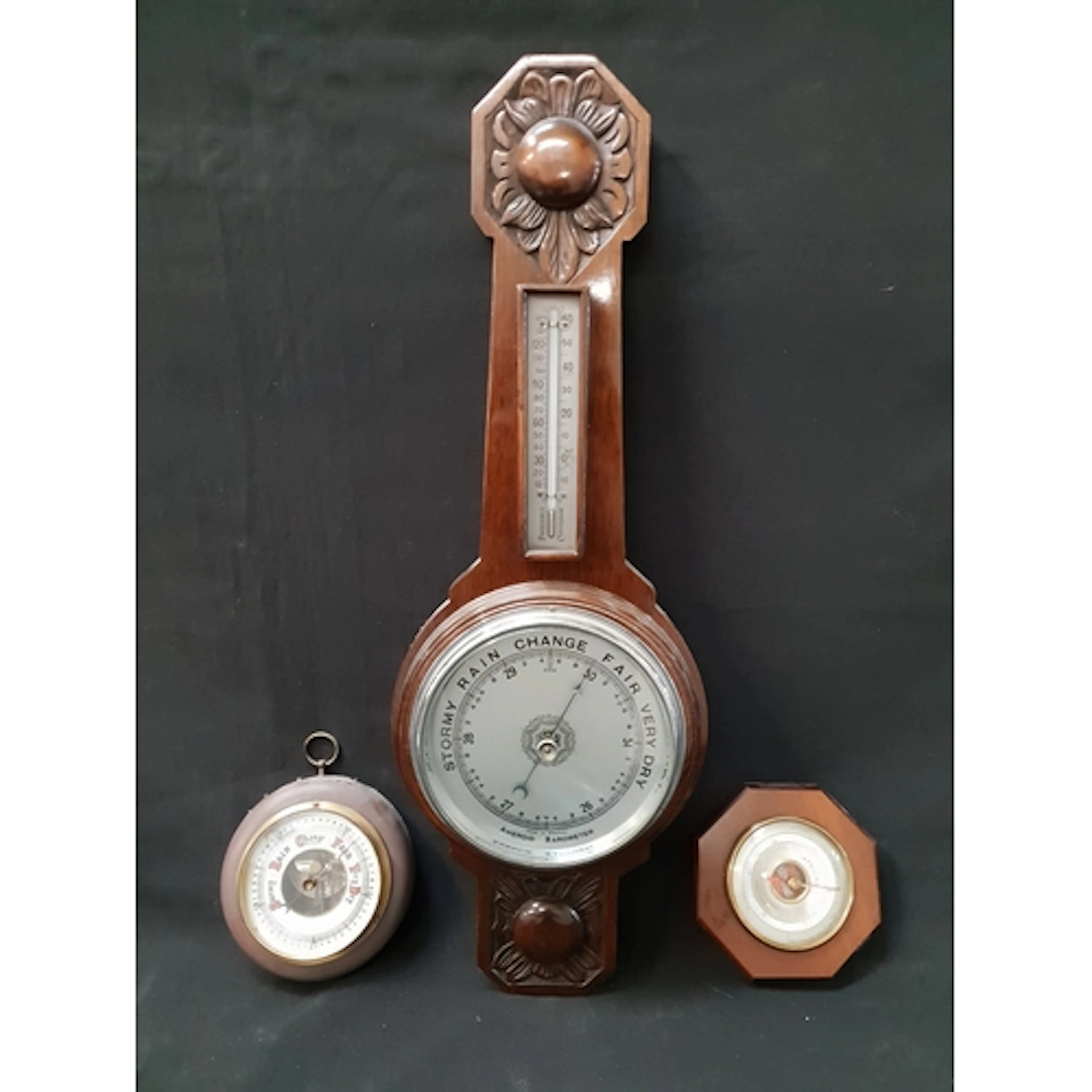SELECTION OF THREE BAROMETERS one with carved flower motif a...