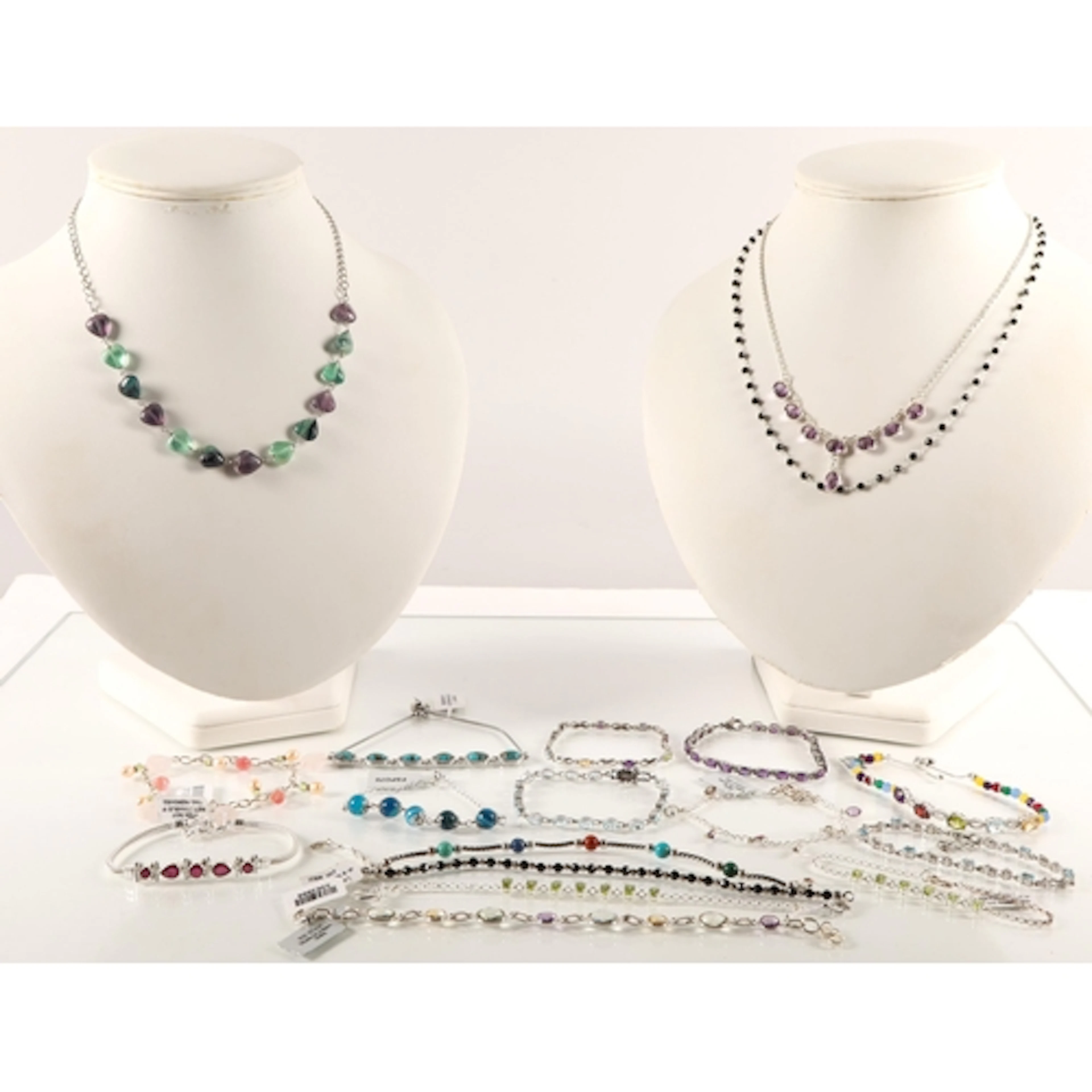 Gemstone set silver bracelets and necklaces to include fluor...