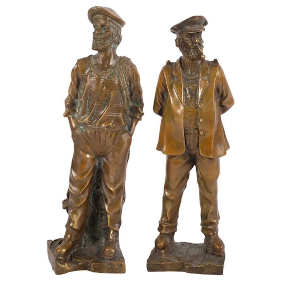 A pair of hollow cast-bronze fishermen, tallest 36cm