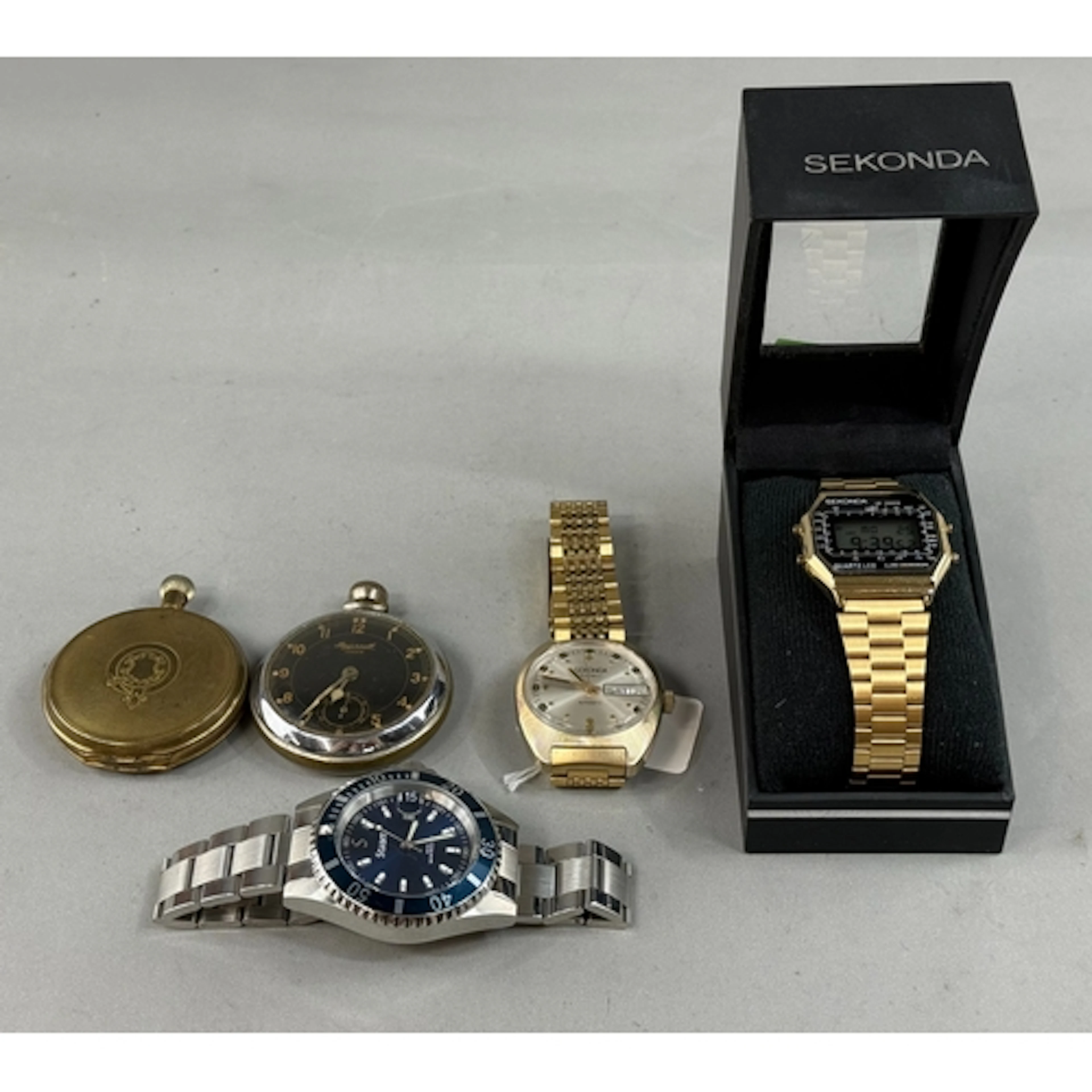 Watches: a boxed Stauer Excursion Divers watch, with blue di...