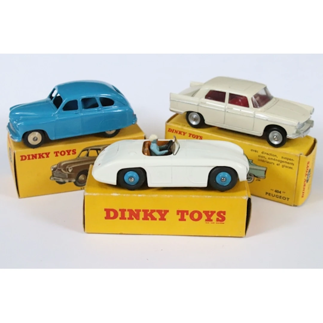 Three boxed Dinky diecast models to include French 553 Peuge...