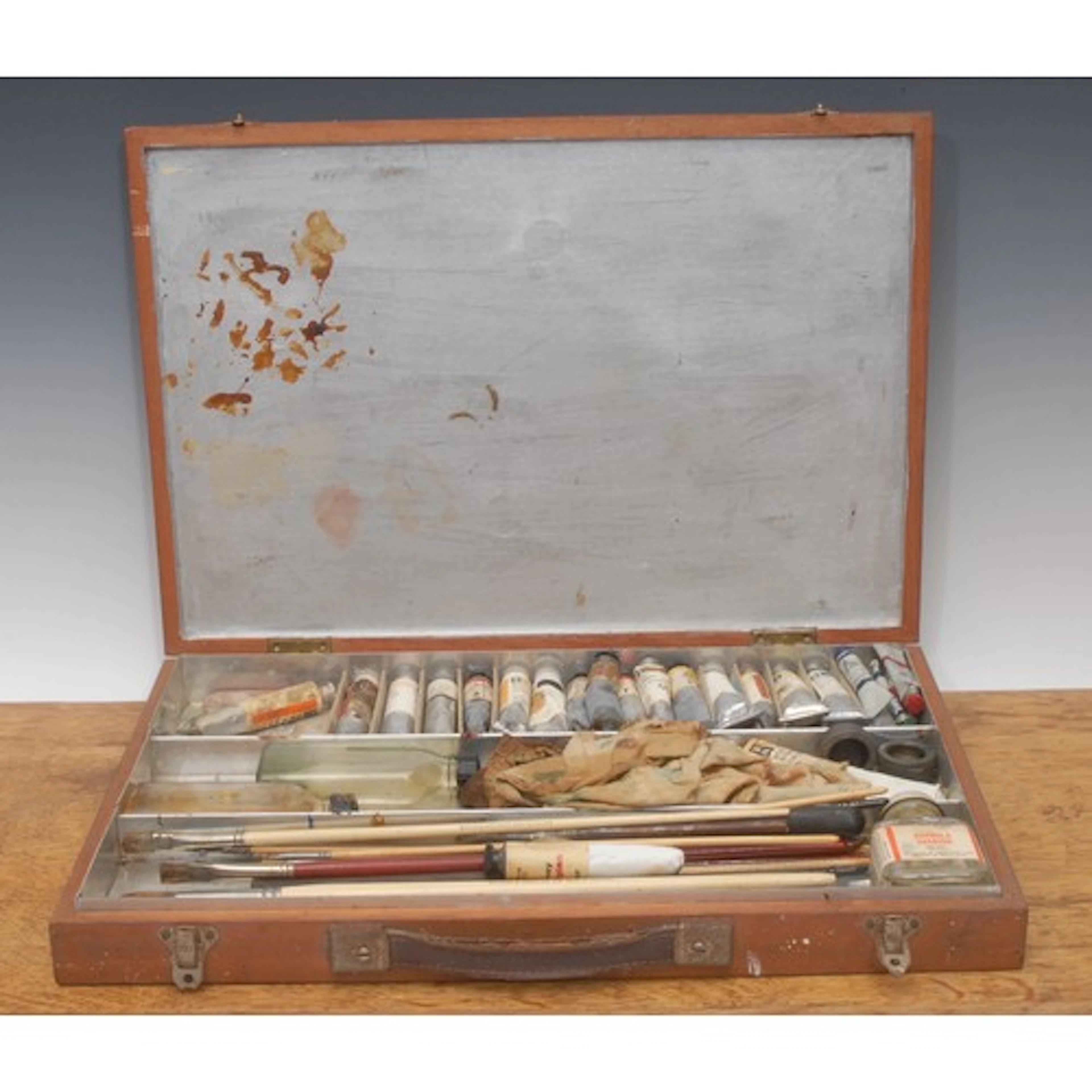 An artist's paint box, the hinged cover enclosing provision ...