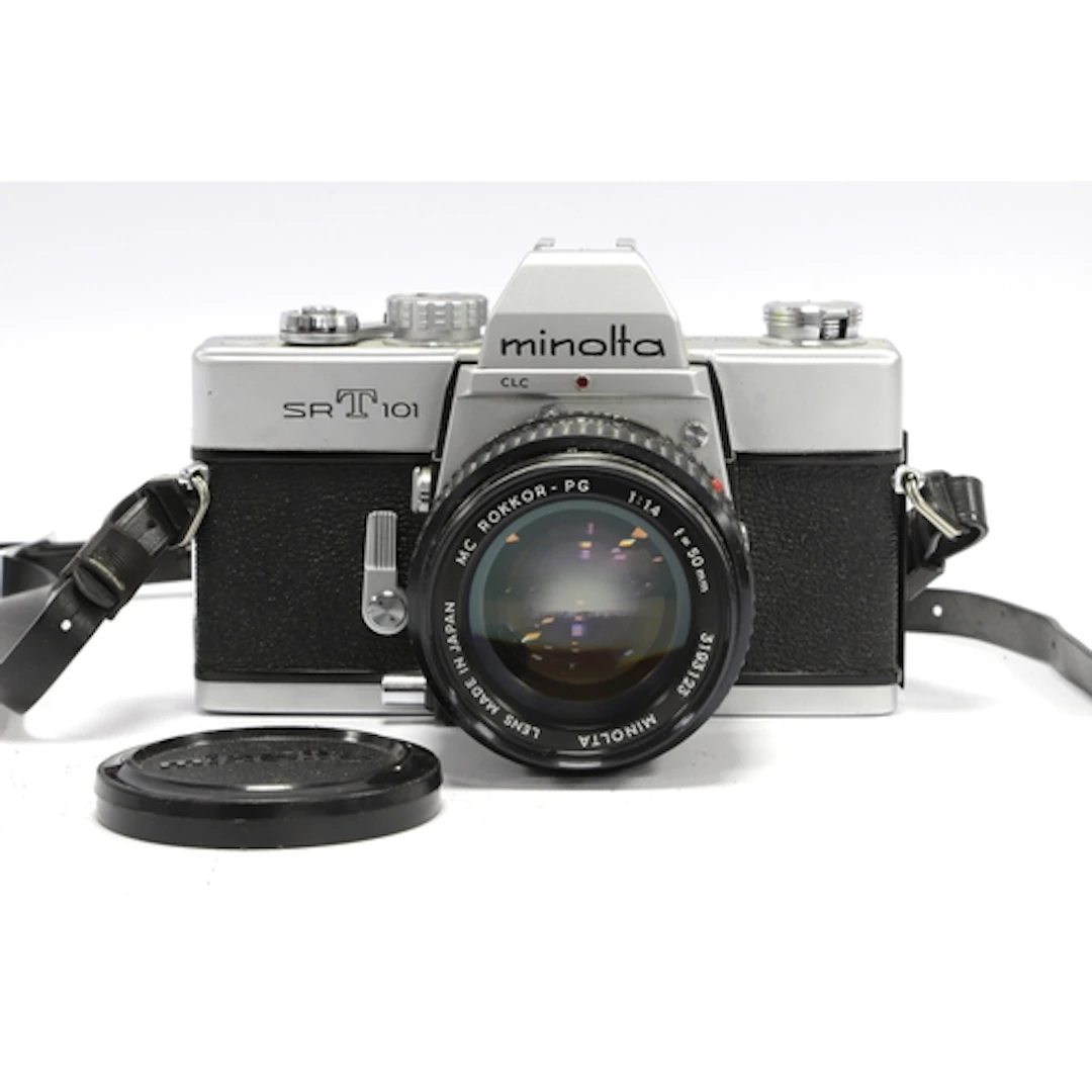 Minolta SRT101 35mm SLR Film Camera with attached Minolta MC...