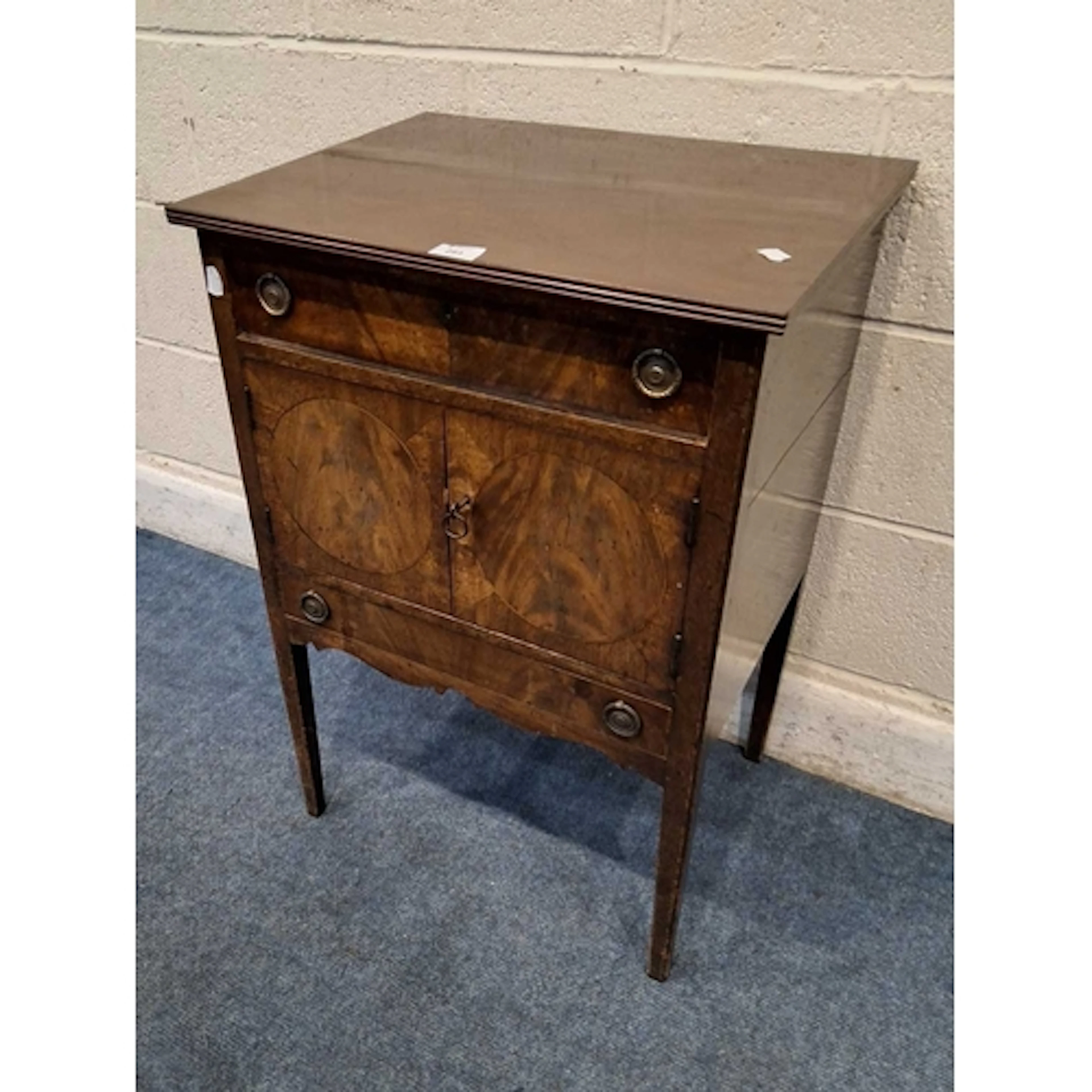 A GEORGIAN AND LATER MAHOGANY POT CUPBOARD, fitted with a si...