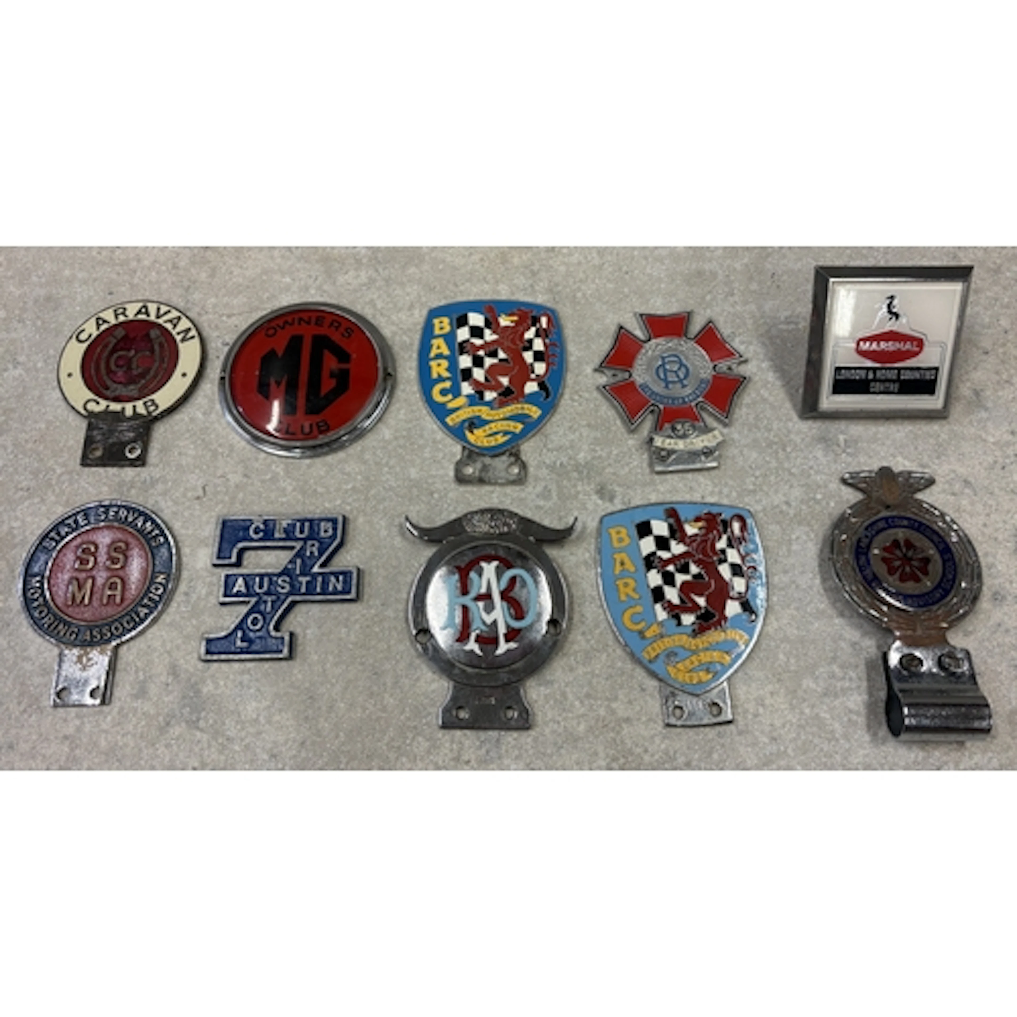 A collection of ten car badges to include BARC, Royal Antedi...