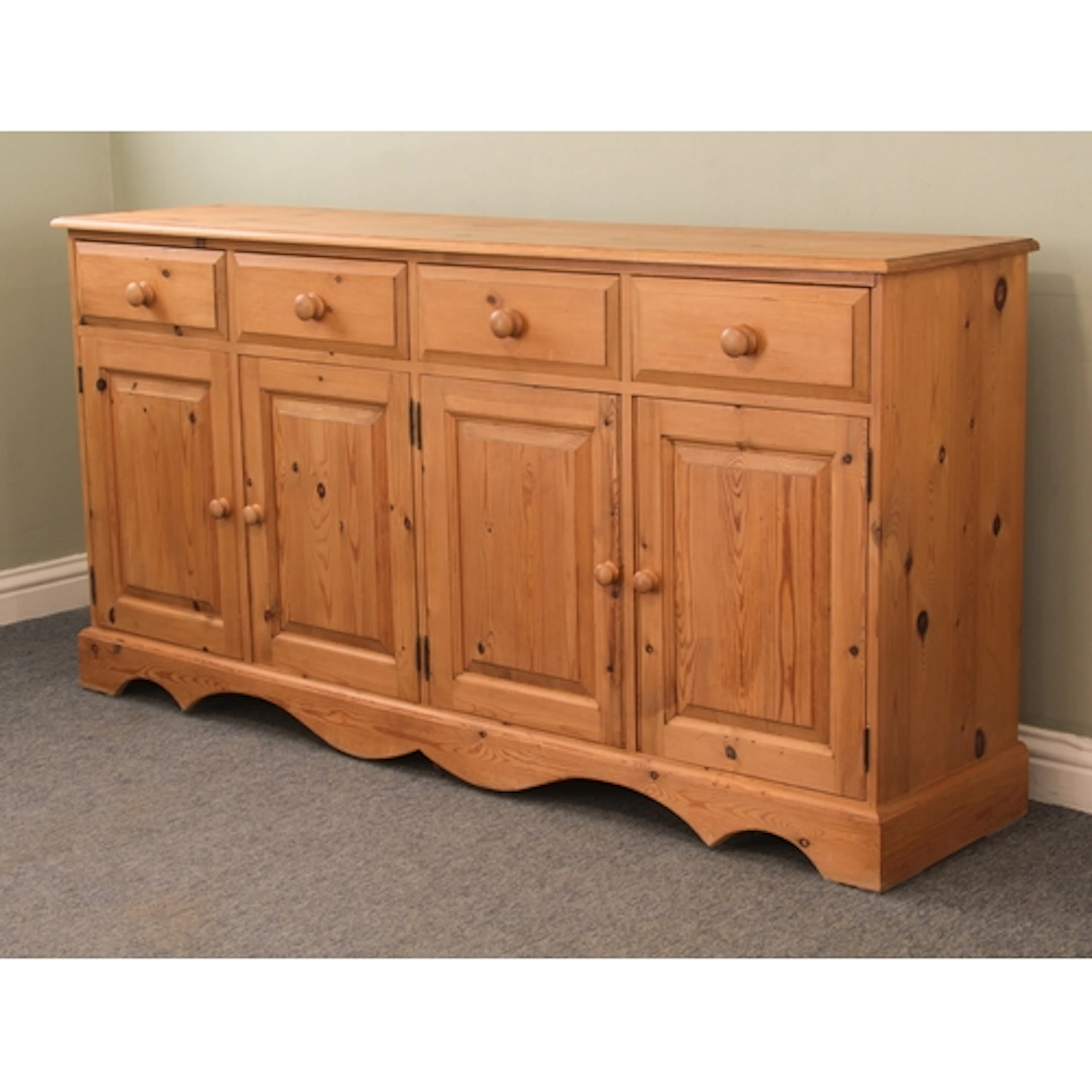 A pine dresser base - late 20th century, with four chamfered...