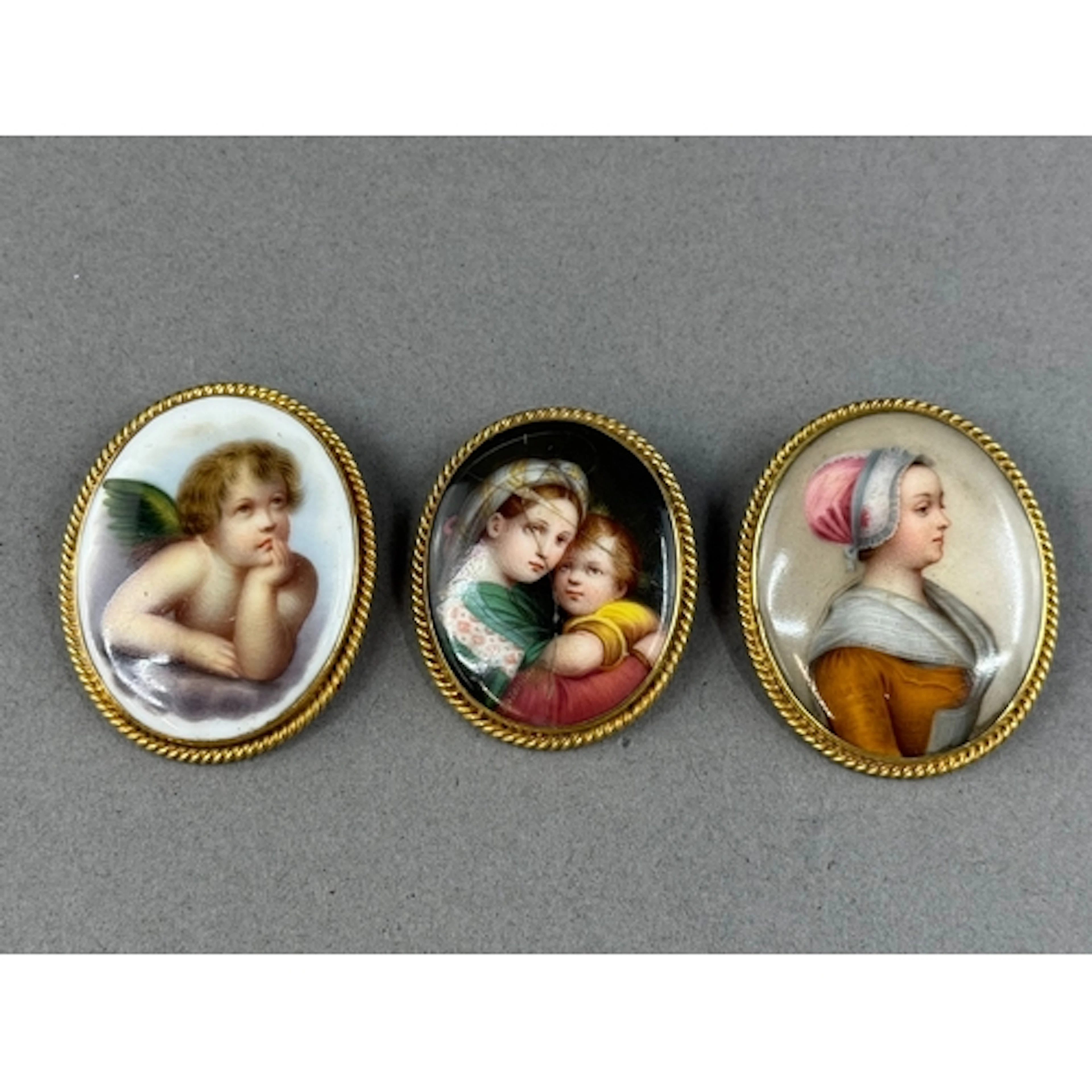 Jewellery: an oval porcelain plaque brooch painted with the ...