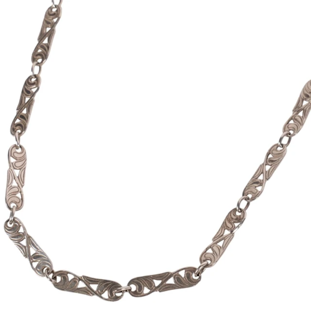 An Art Nouveau silver panel link chain necklace of scrolled ...