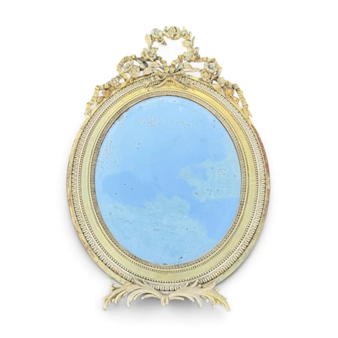 A LATE 19TH CENTURY FRENCH OVAL GILTWOOD AND GESSO FRAME WAL...