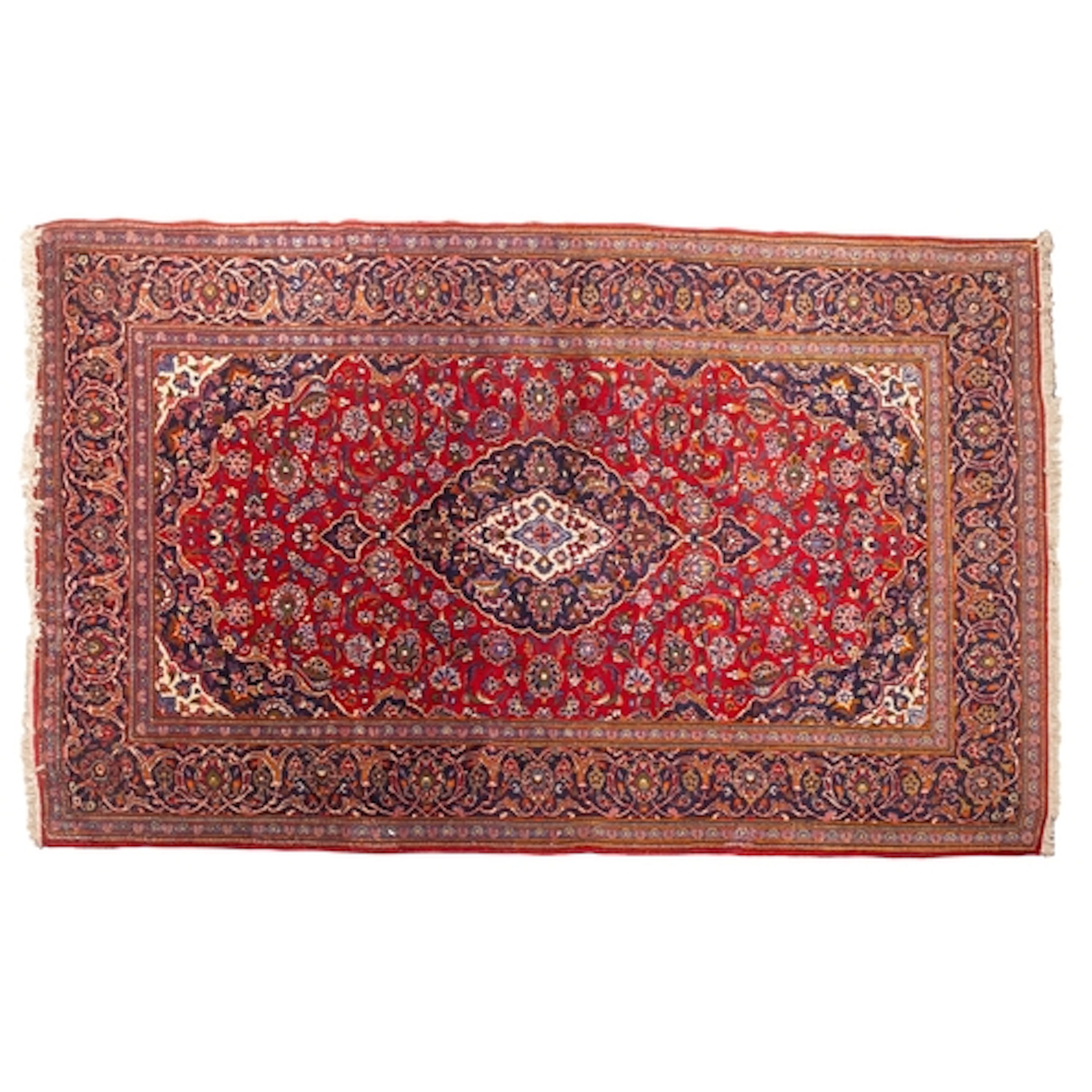 A Kashan carpet, the wine field with a central indigo and iv...