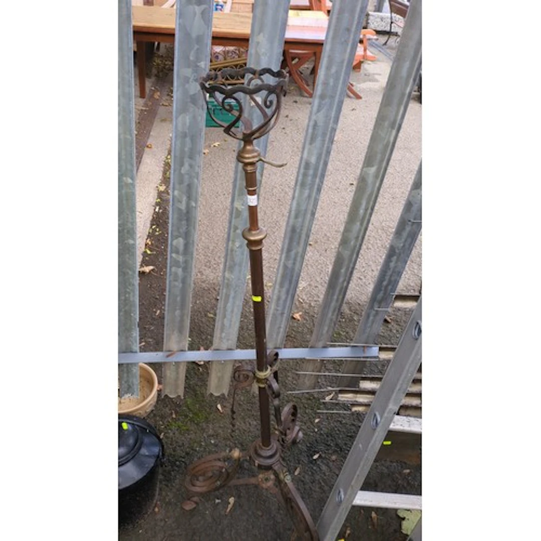 Adjustable brass and wrought-iron jardinière stand.