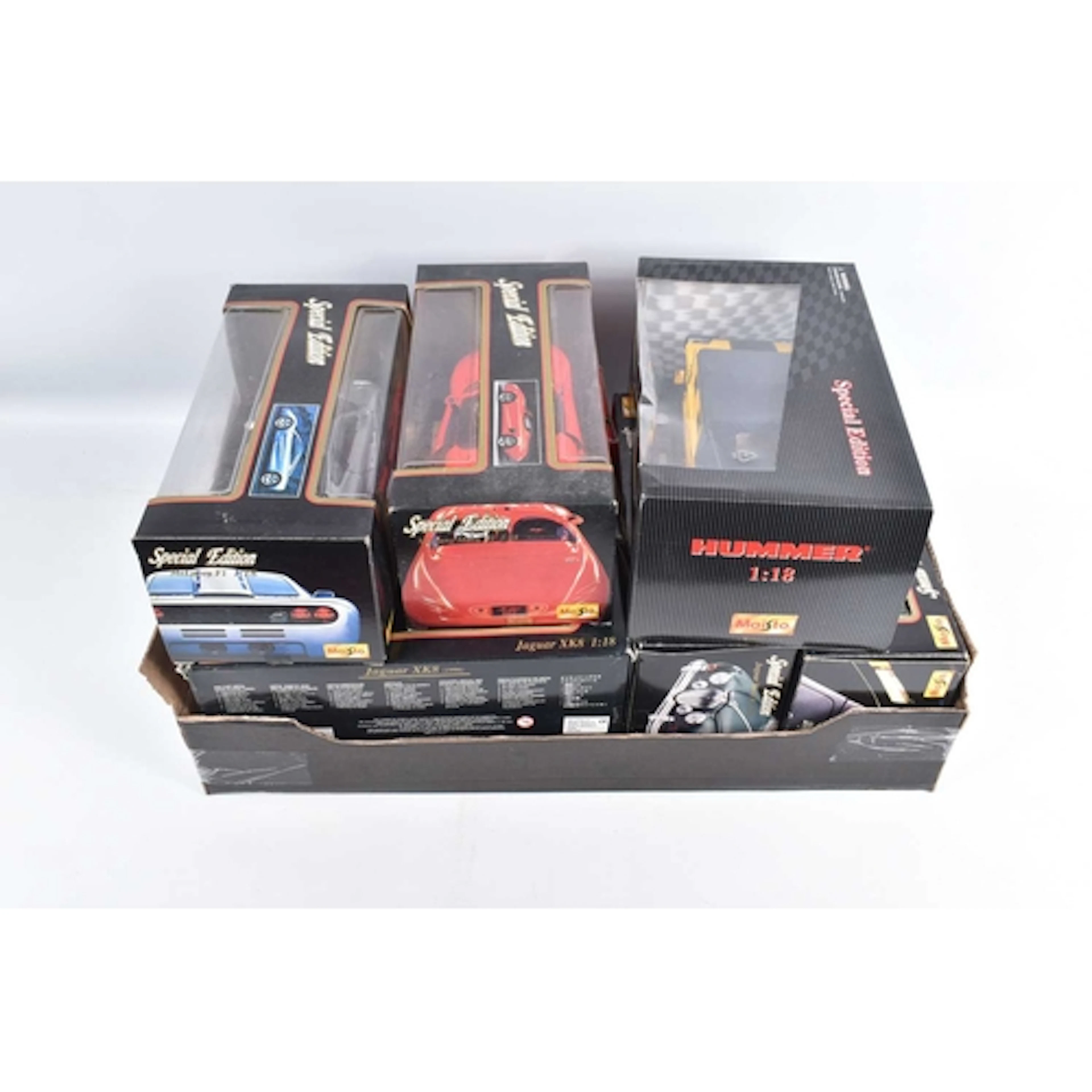 EIGHT BOXED 1:18 SCALE DIECAST MODEL VEHICLES, to include se...