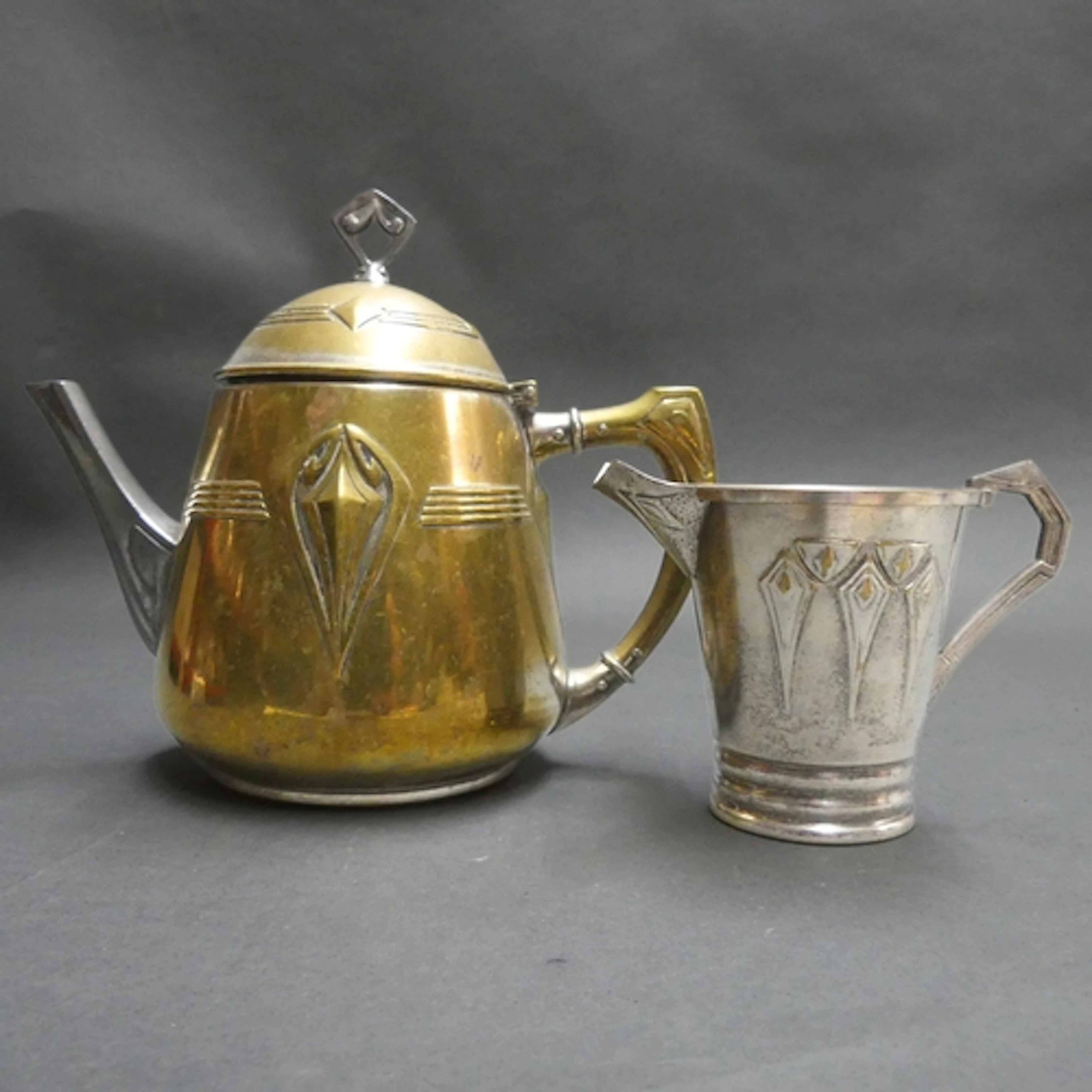 WMF - An Art Nouveau silver plated teapot and matching cream...