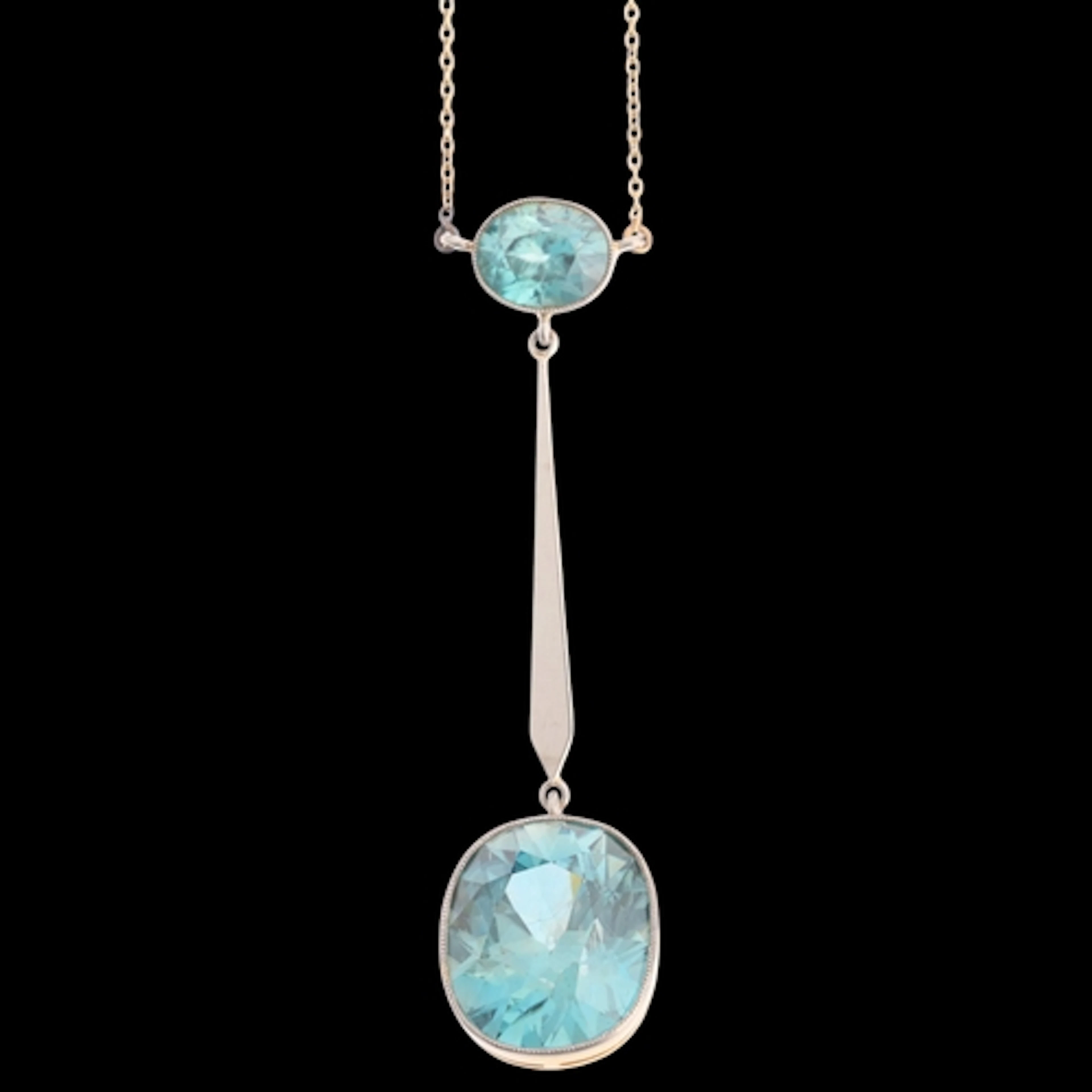 An Edwardian 15ct gold blue zircon drop pendant necklace, 18...