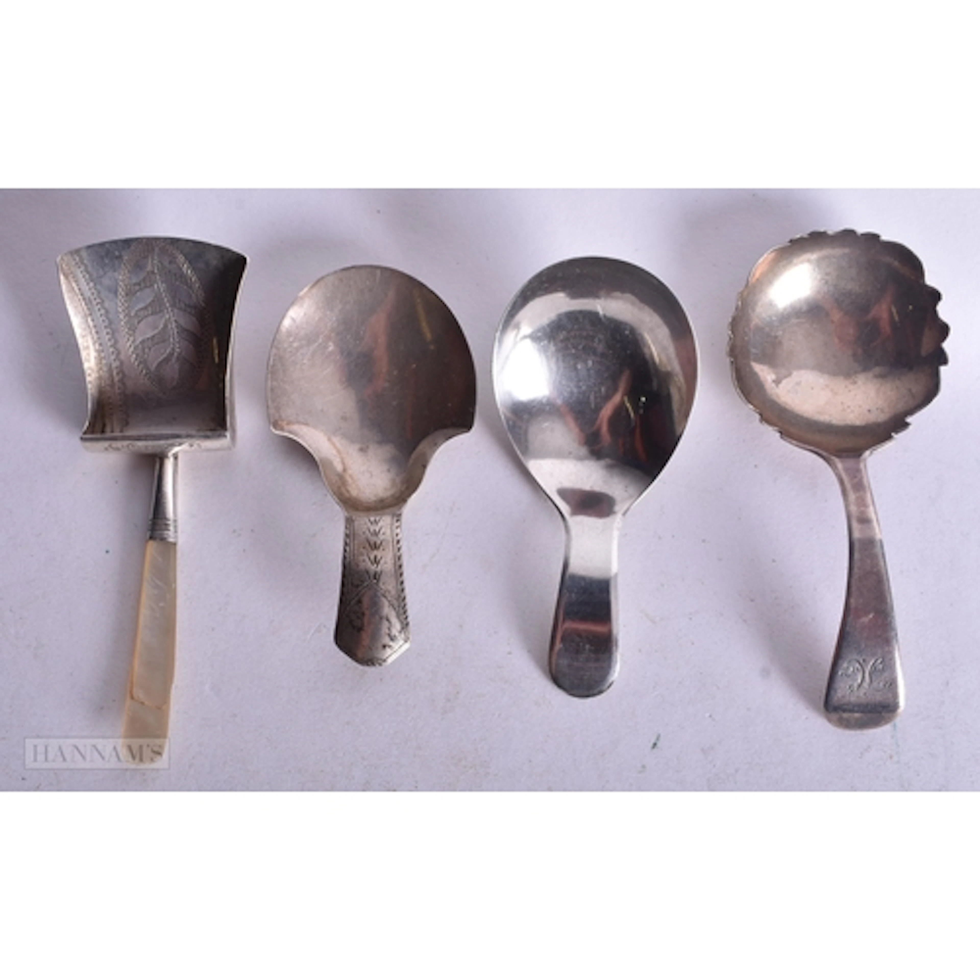 FOUR ANTIQUE SILVER CADDY SPOONS. 33 grams. (4)