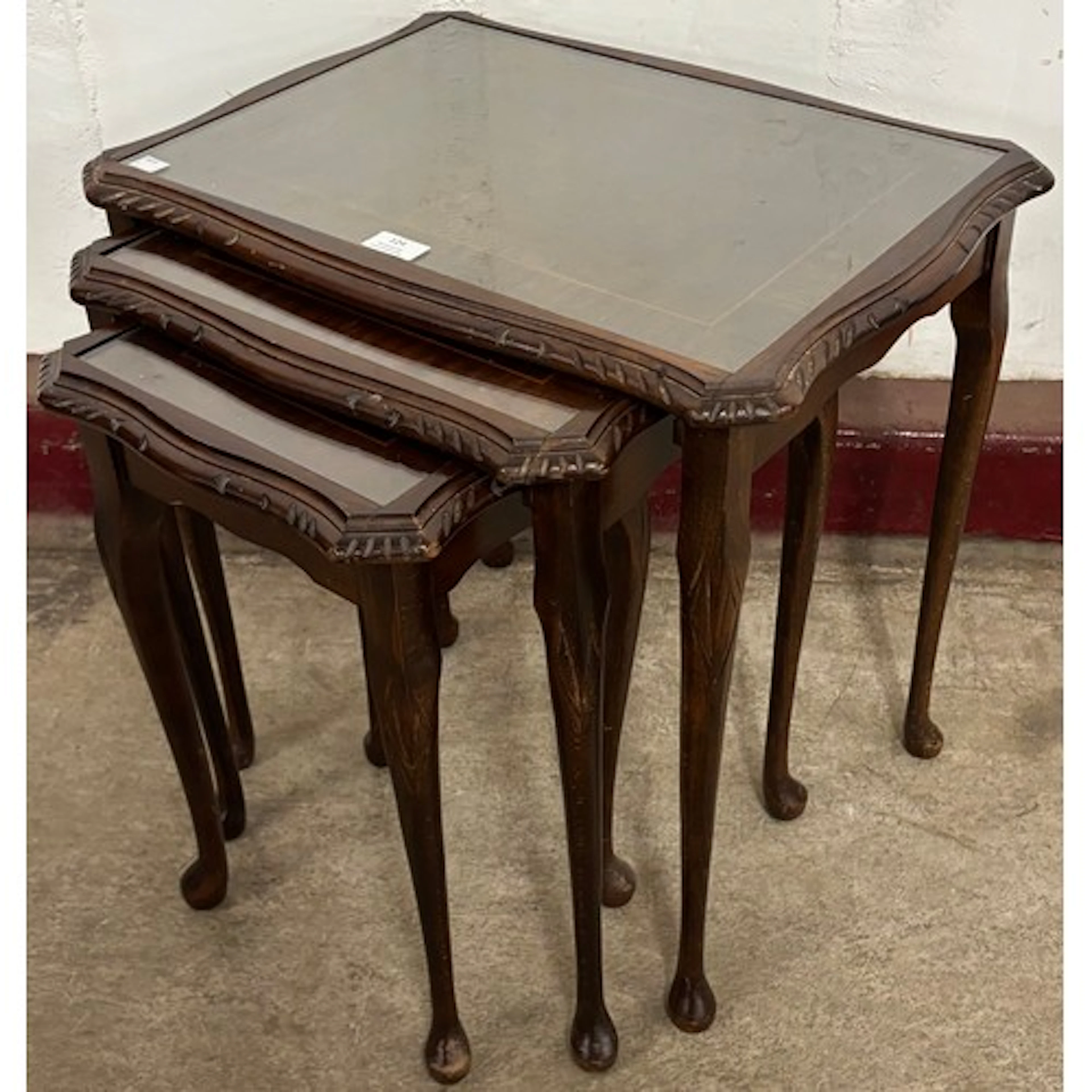 A Queen Anne style mahogany nest of tables
