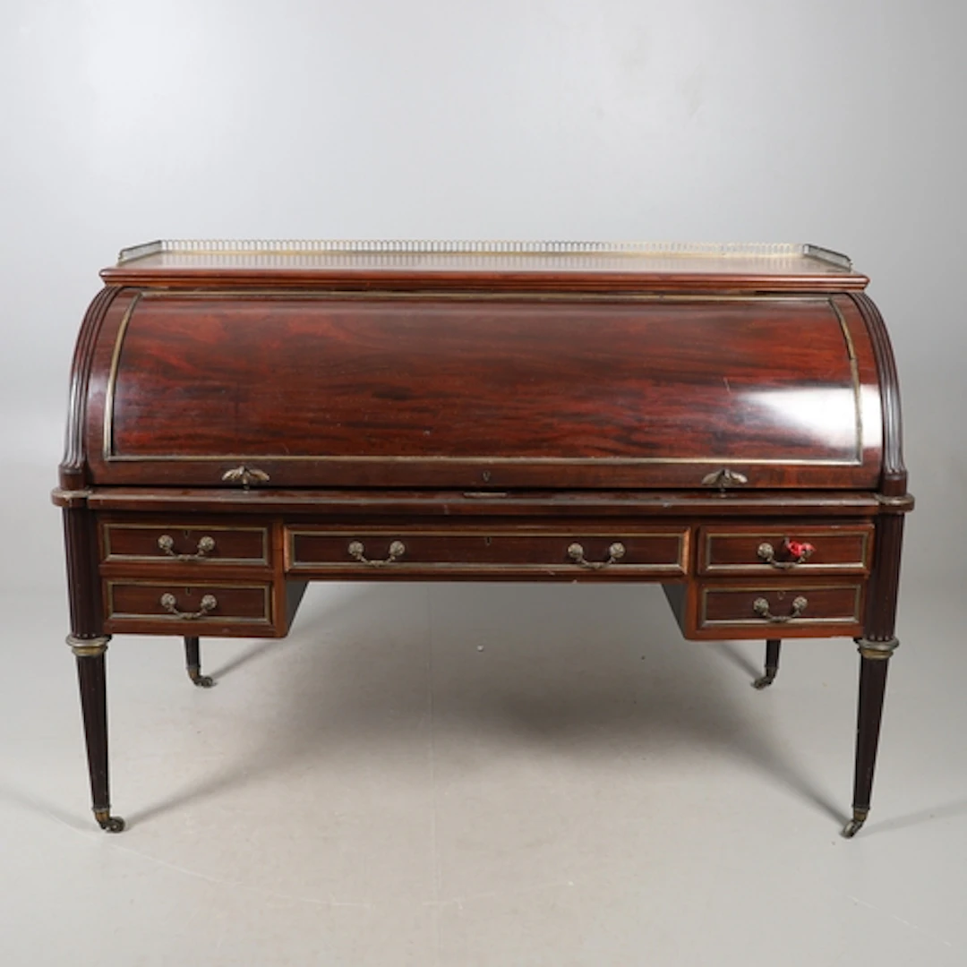 A SUBSTANTIAL EDWARDIAN MAHOGANY CYLINDER DESK BY WILLIAM BE...