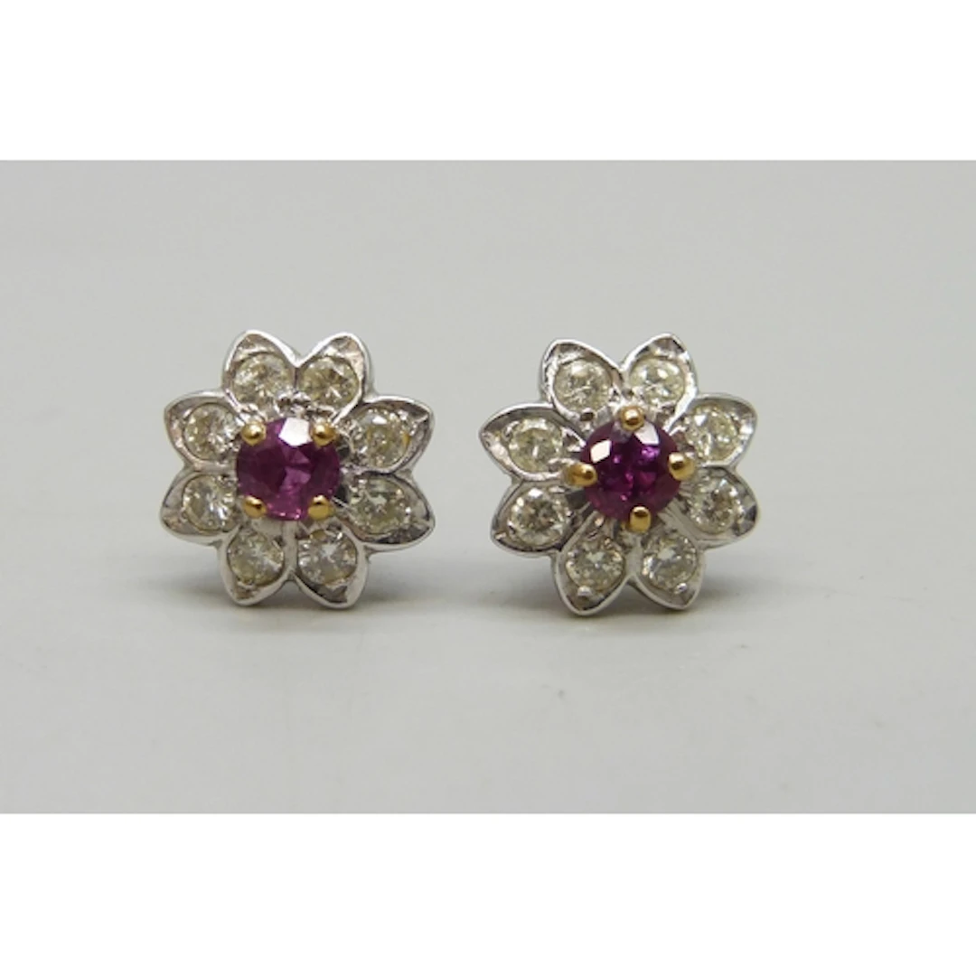 A pair of white metal, ruby and diamond cluster earrings, 3....