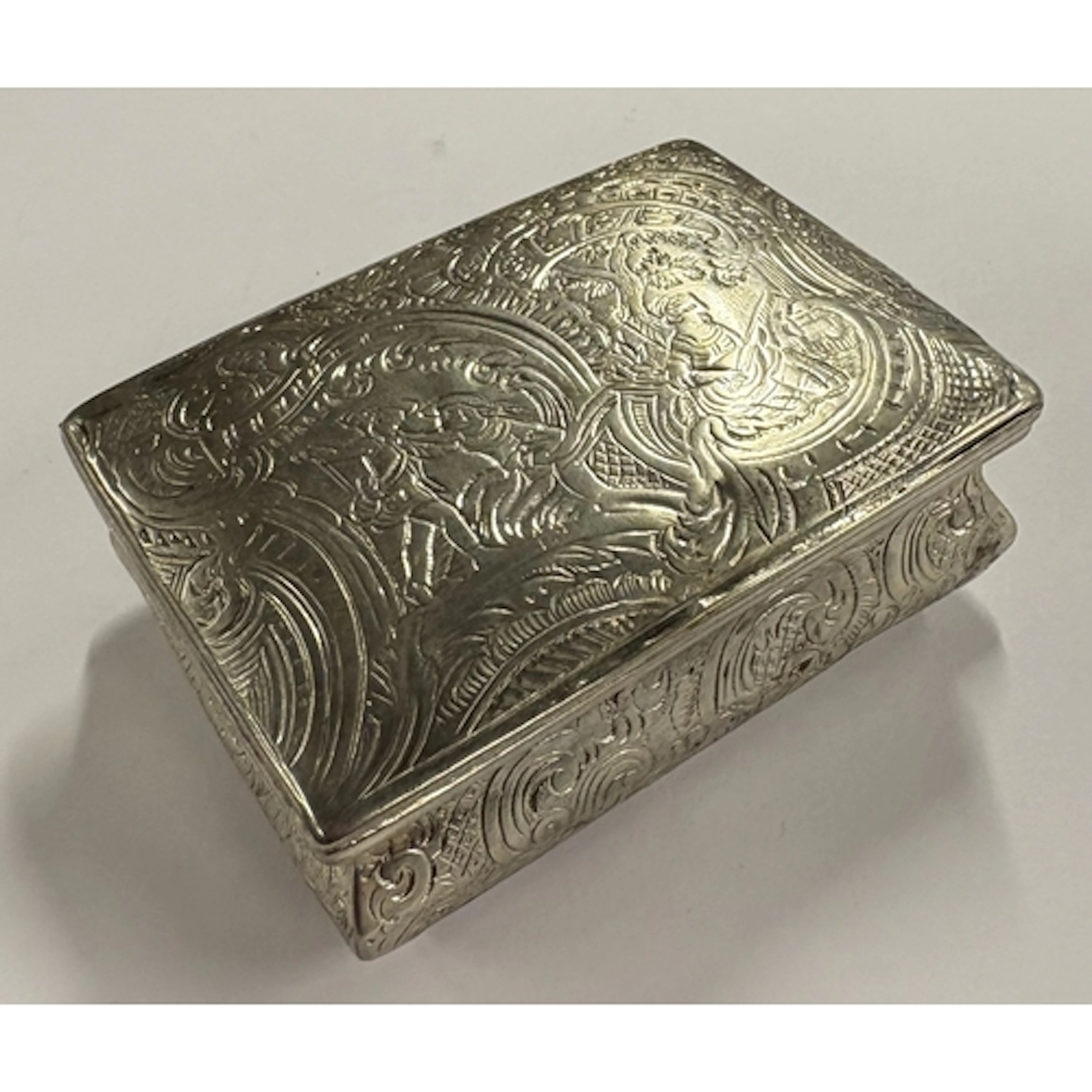 An 18th Century silver snuff box with engraved decoration. A...