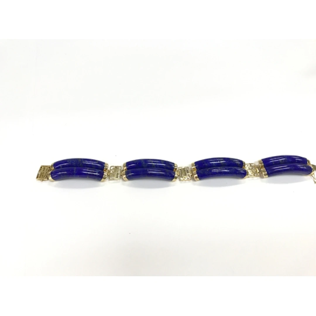A 14k Chinese style link bracelet made with curved lapis laz...