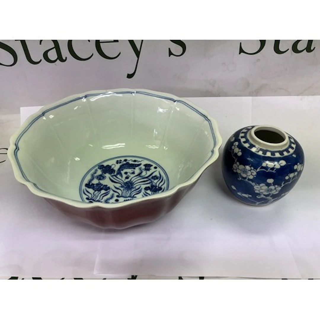 A Chinese sang de bouef bowl with fluted sides and decorated...