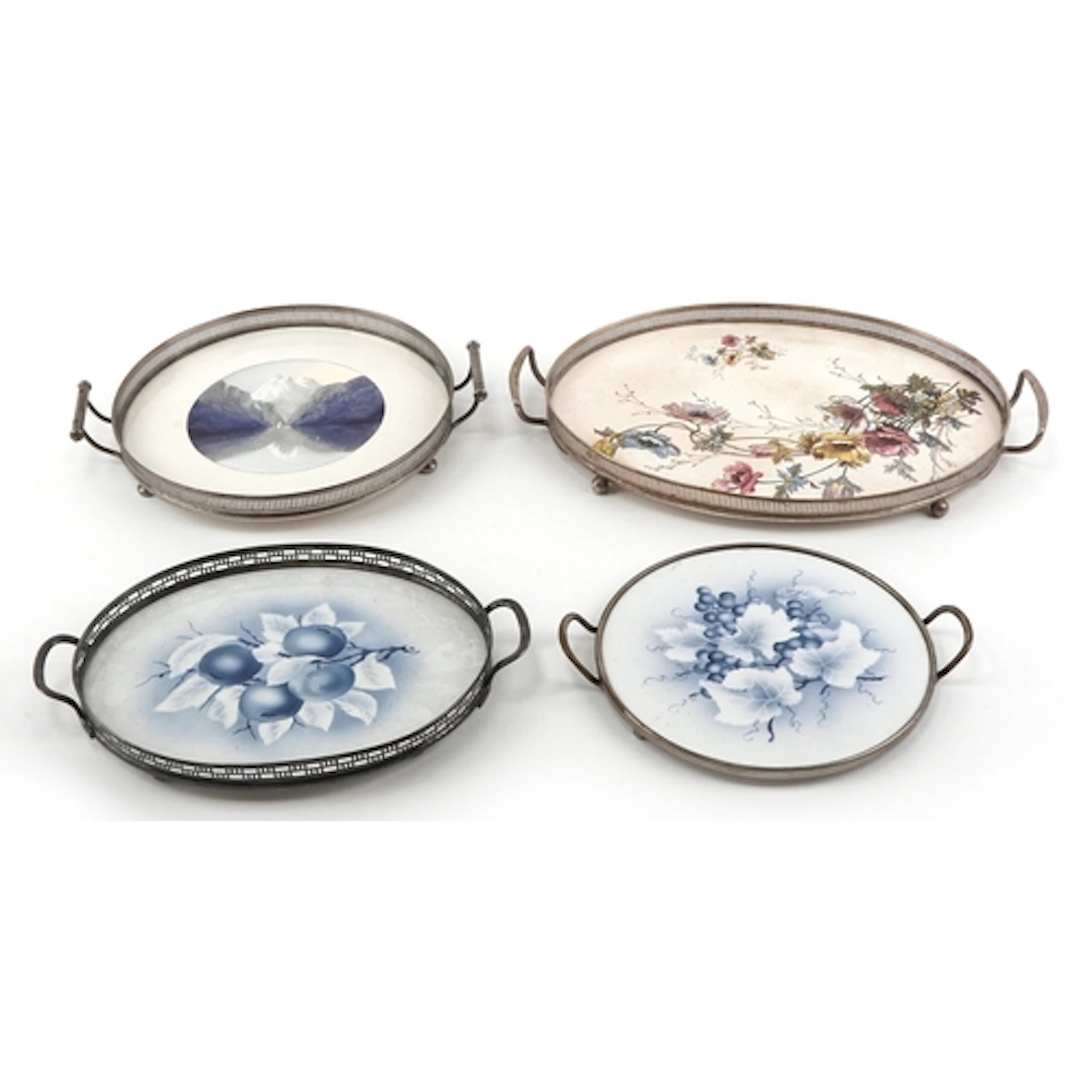 Four antique silver plated and ceramic trays including a WMF...