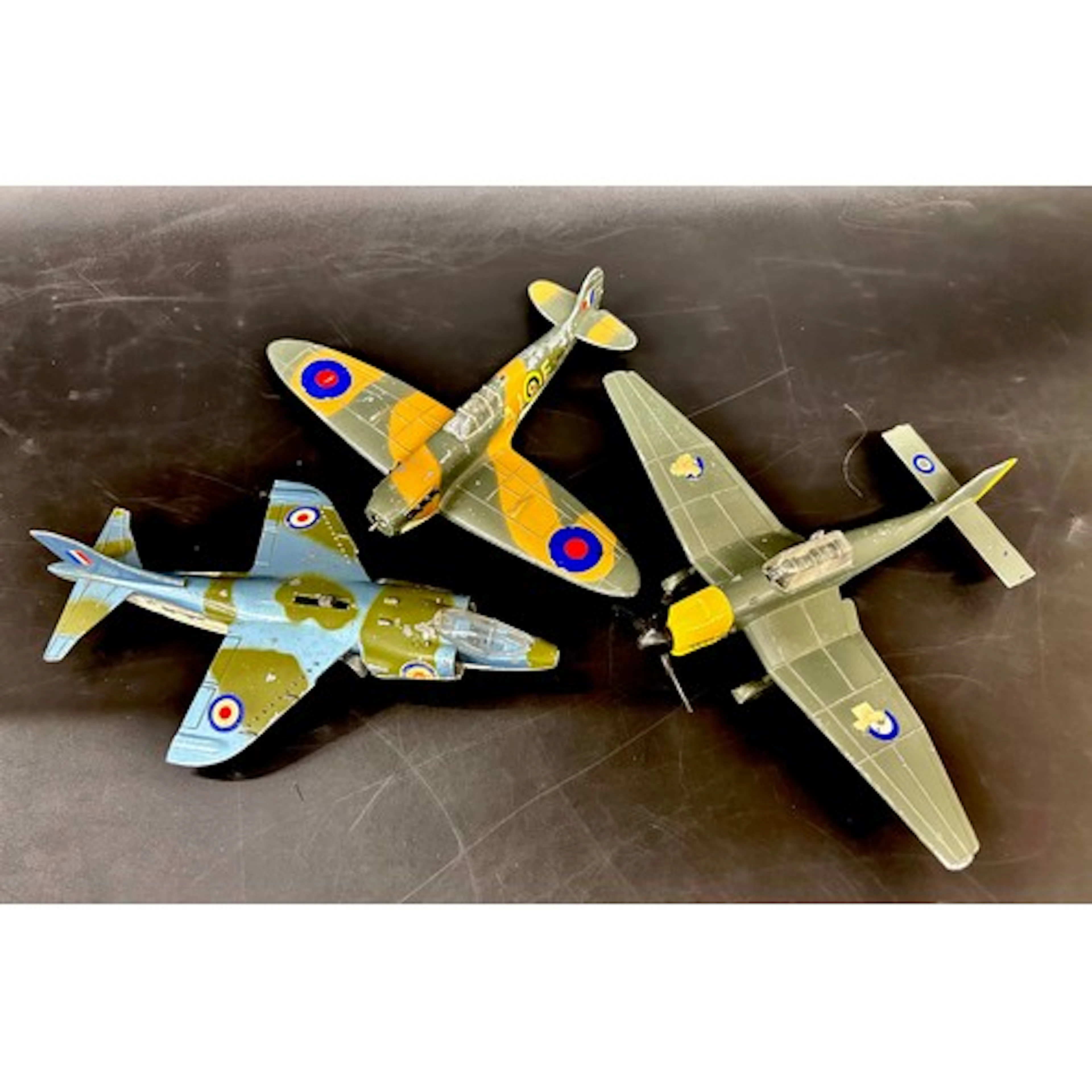 Three Dinky Toys Meccano aircraft; Spitfire MII, Junkers JU8...