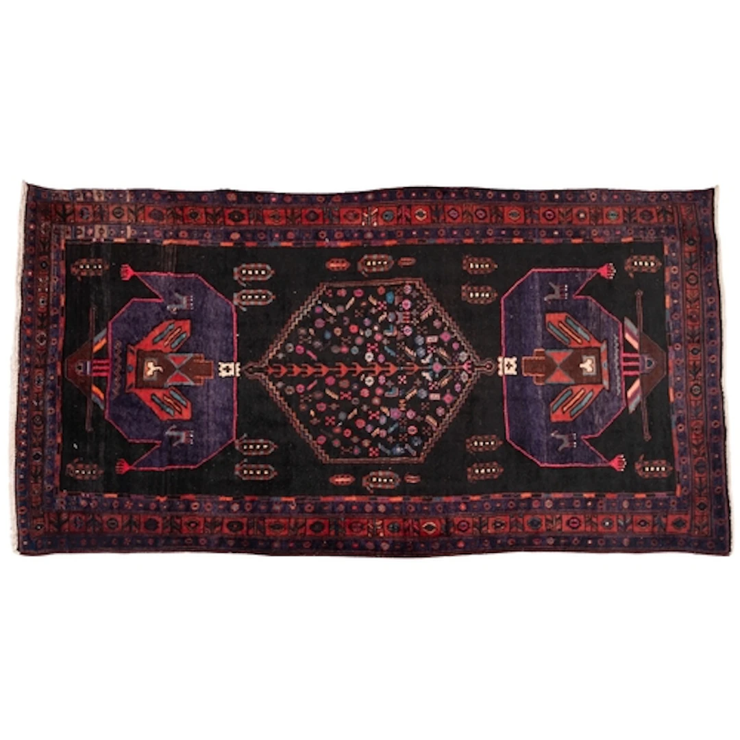 A Contemporary Iranian rug, the black field with a central s...