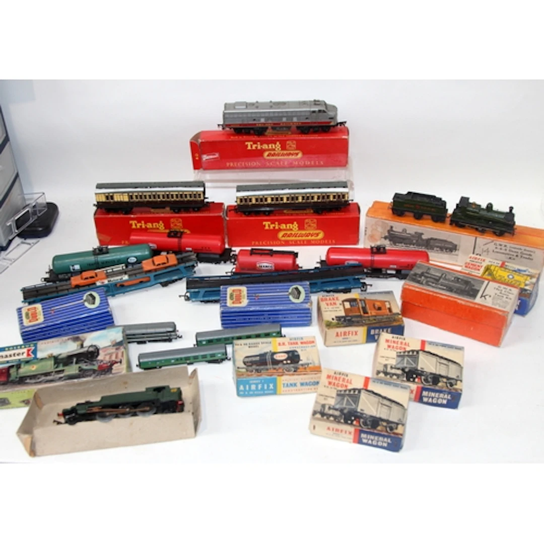 A collection of OO gauge goods wagons and trackside accessor...