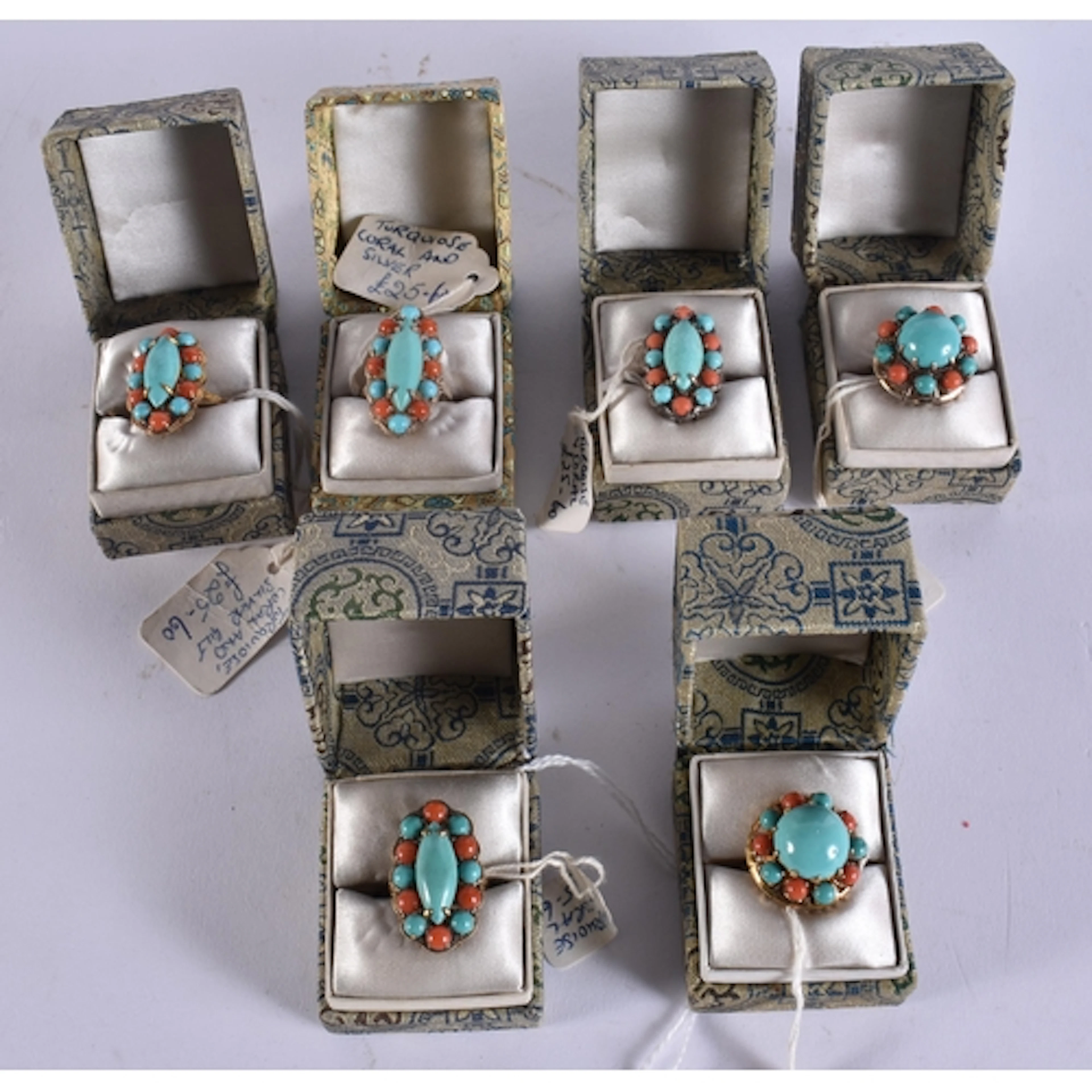 SIX CHINESE SILVER CORAL AND TURQUOISE RINGS in various form...