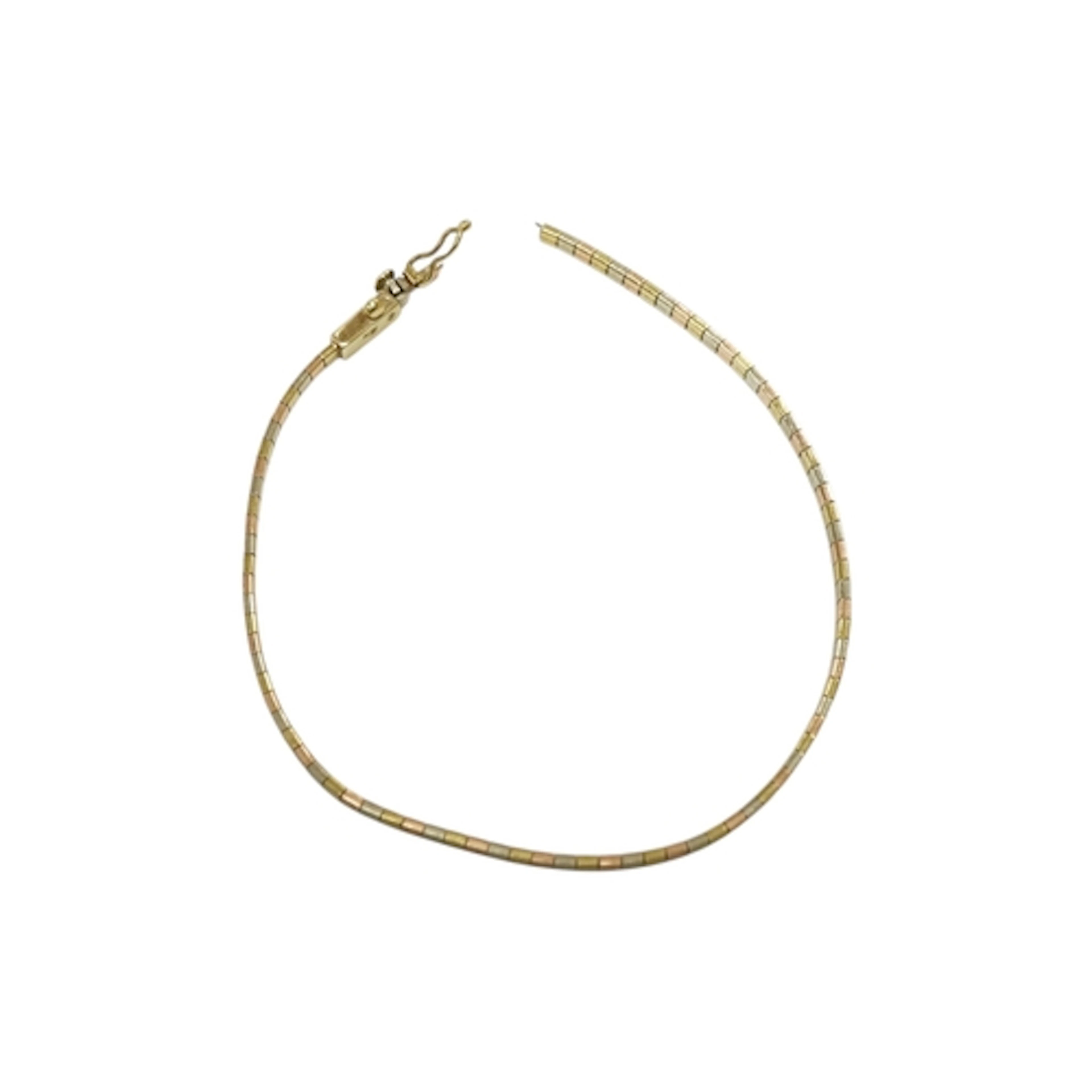A recent three colour 9k flat link bracelet(a.f.), 5.4 grams...